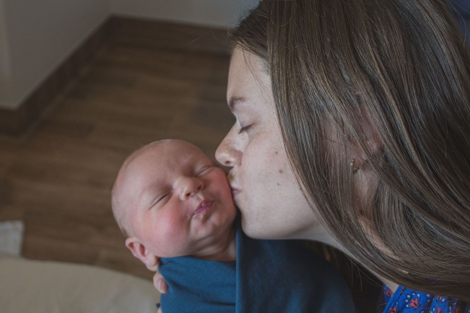 Copperas Cove Fresh 48 Photographer capturing mother kissing newborn baby.