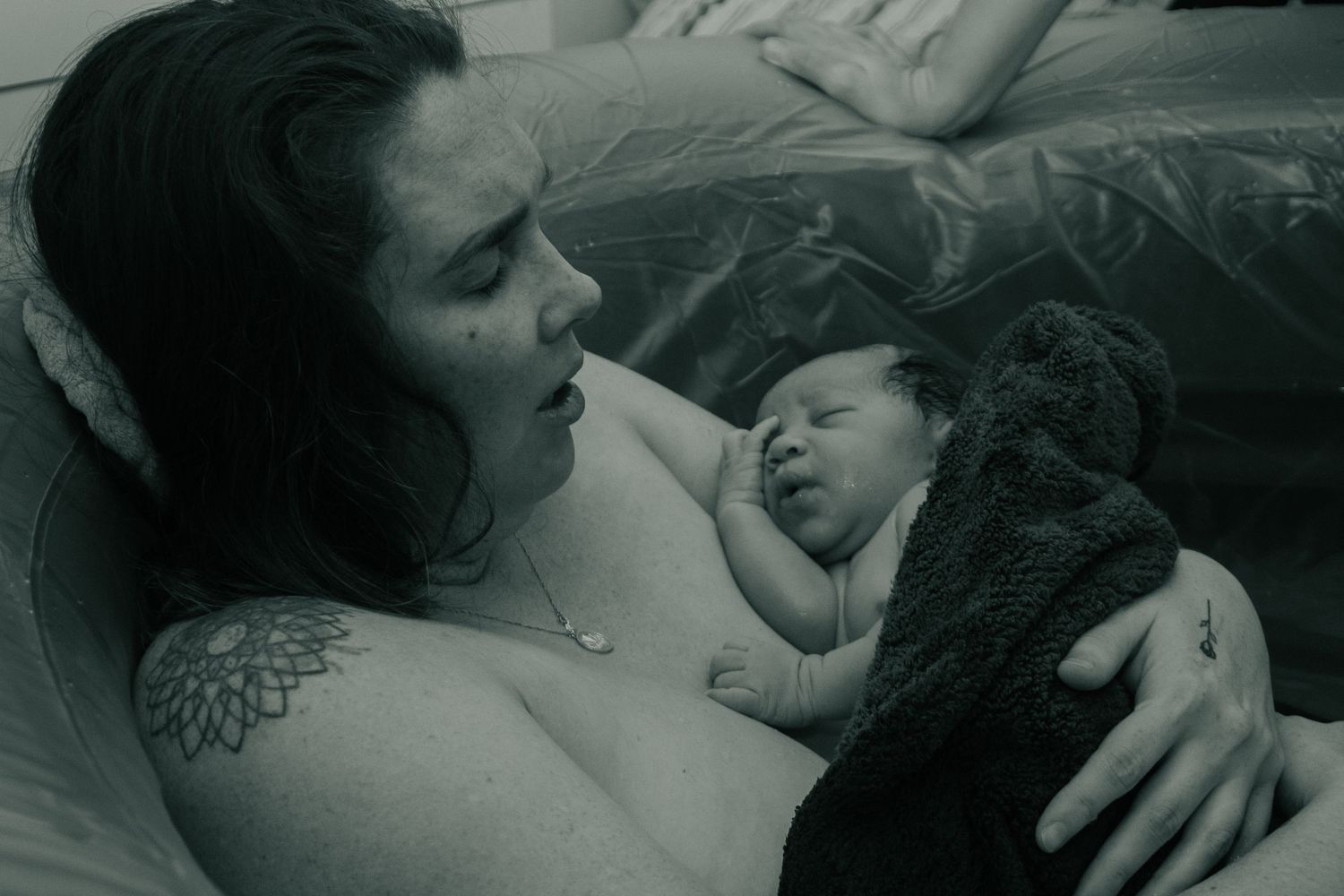 Copperas Cove home Birth Photographer captures mother sighing immediately after giving birth