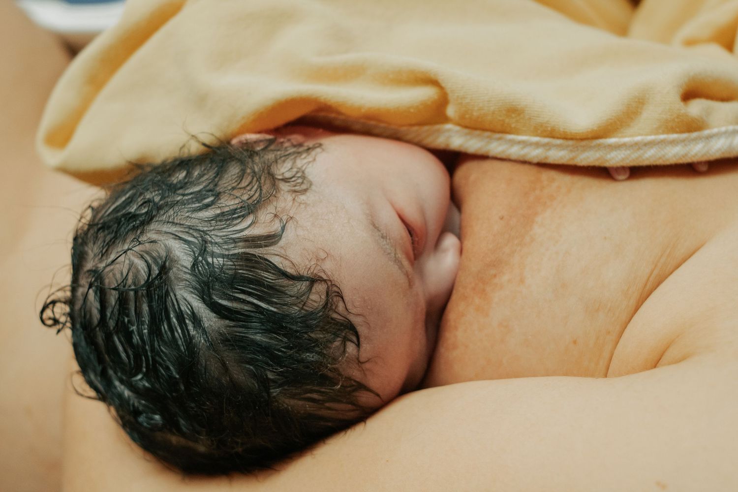 Fort Hood Birth Photographer captures newborn baby nursing for the first time