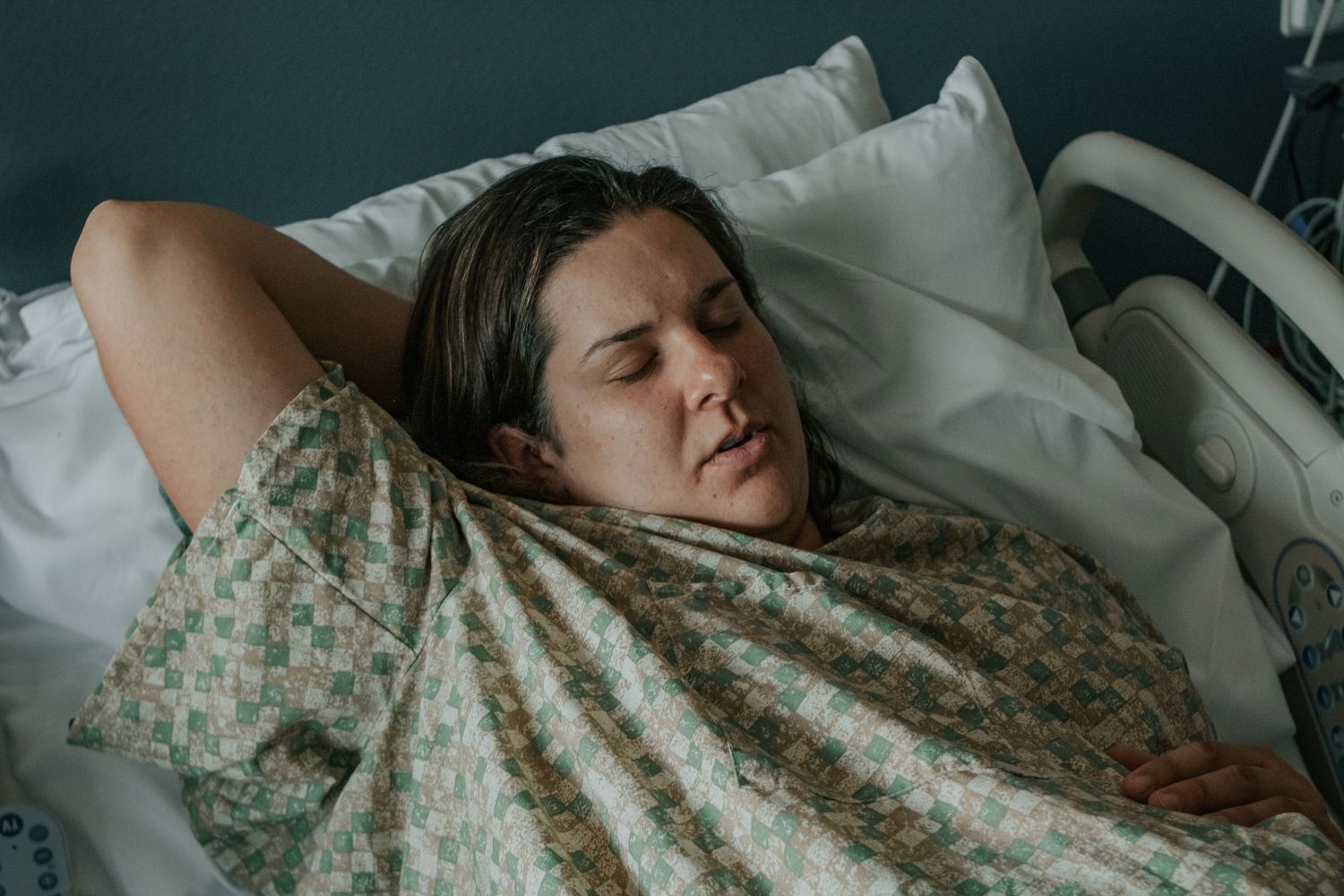 Georgetown Birth Photographer captures mother breathing through early contractions.