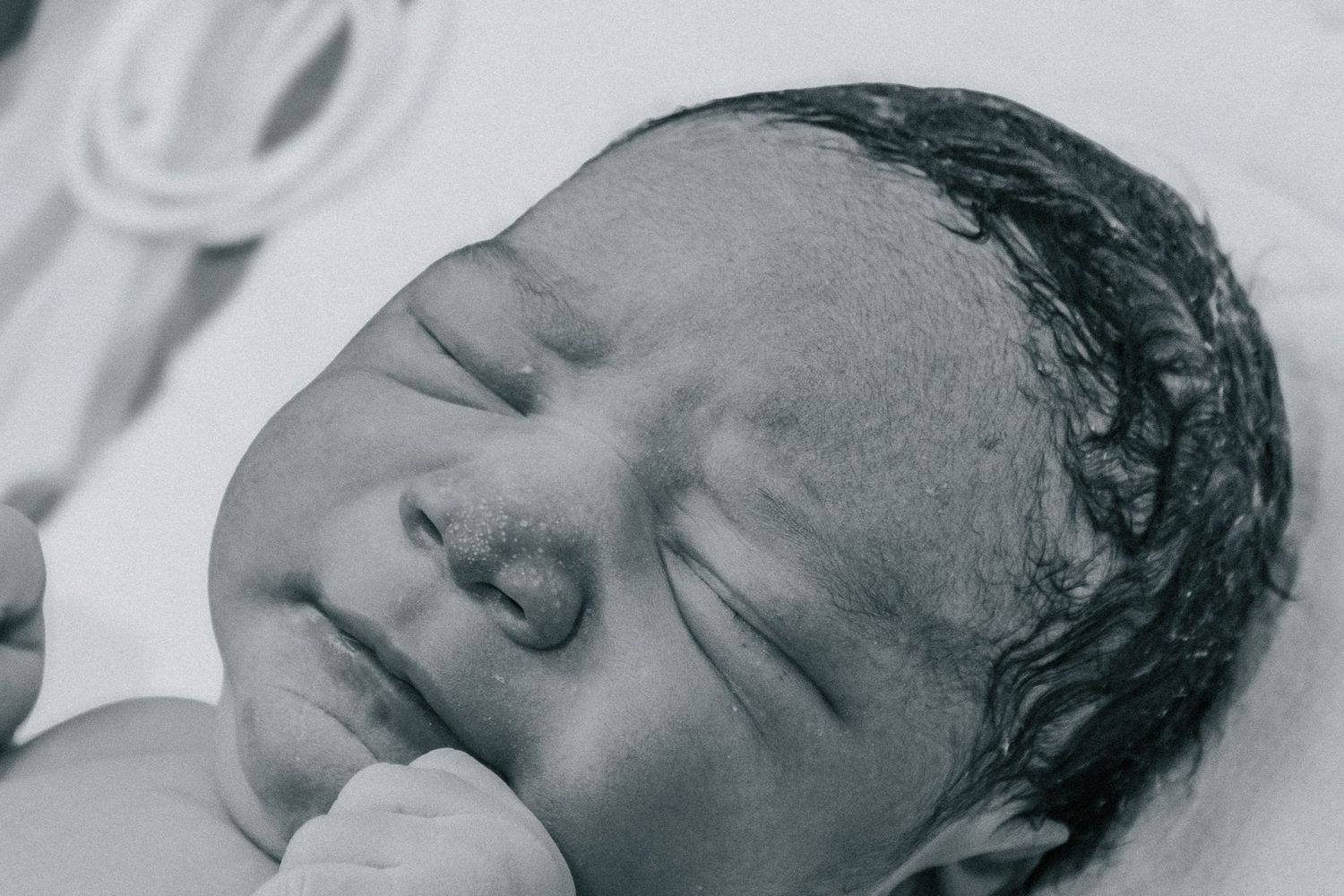 Killeen Birth Photographer captures newborn baby face.