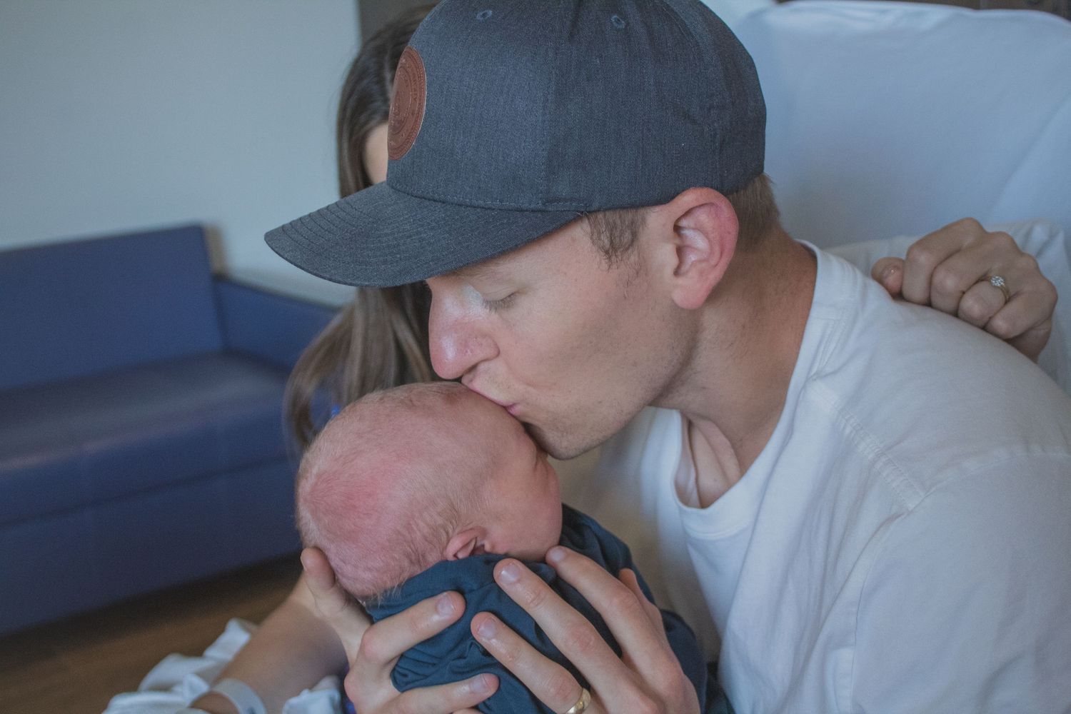 Copperas Cove Fresh 48 Photographer capturing father holding newborn baby.