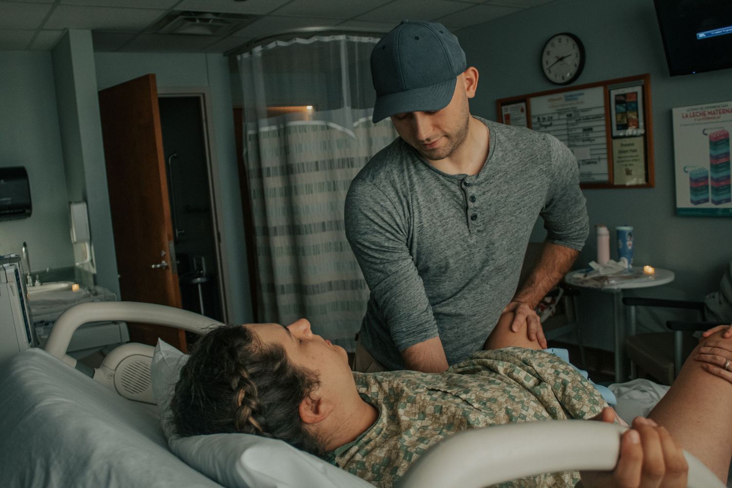 Georgetown Birth Photographer captures husband supporting wife during transition.