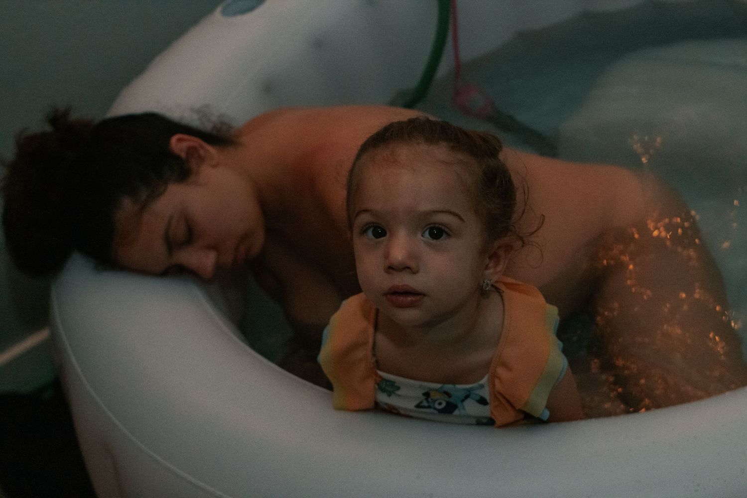 Fort Hood Birth Photographer captures toddler supporting mom in labor