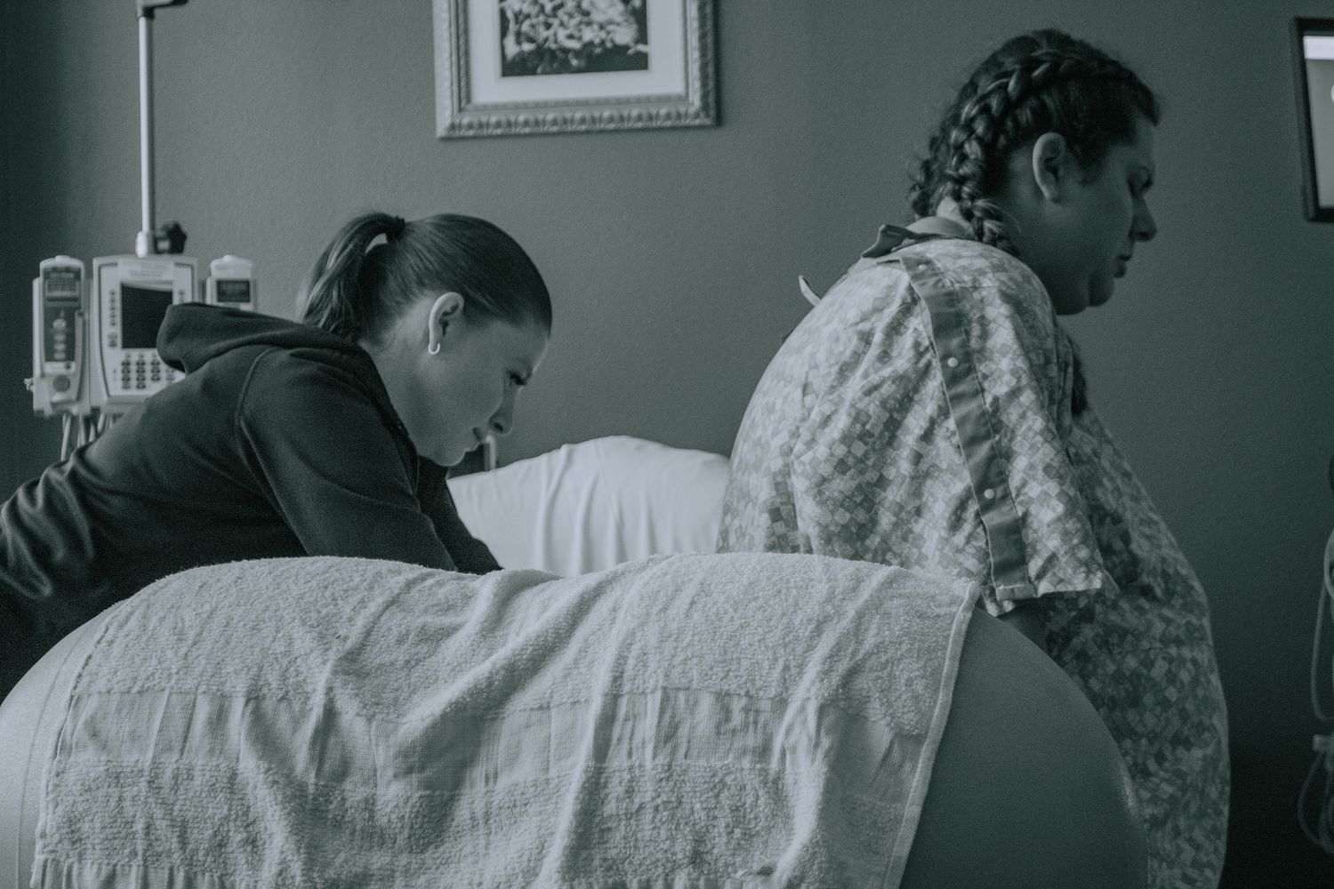 Georgetown doula uses counterpressure to ease mother's discomfort during labor contractions.