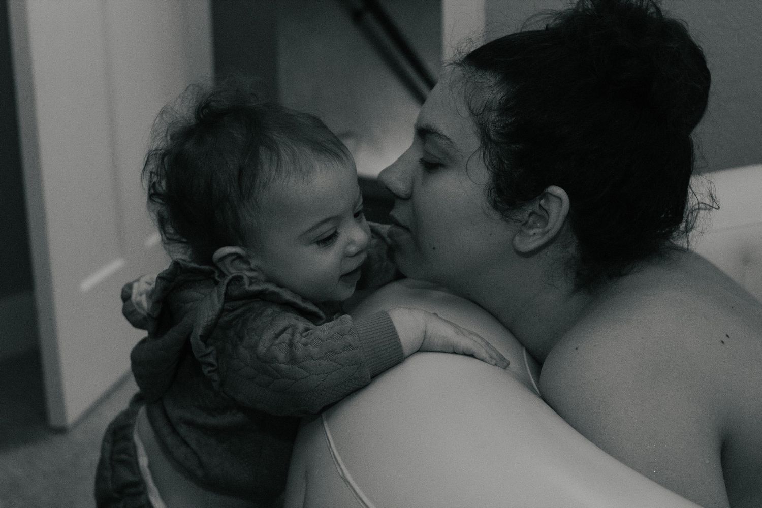 Copperas Cove home birth photographer capturing sibling supported water birth.