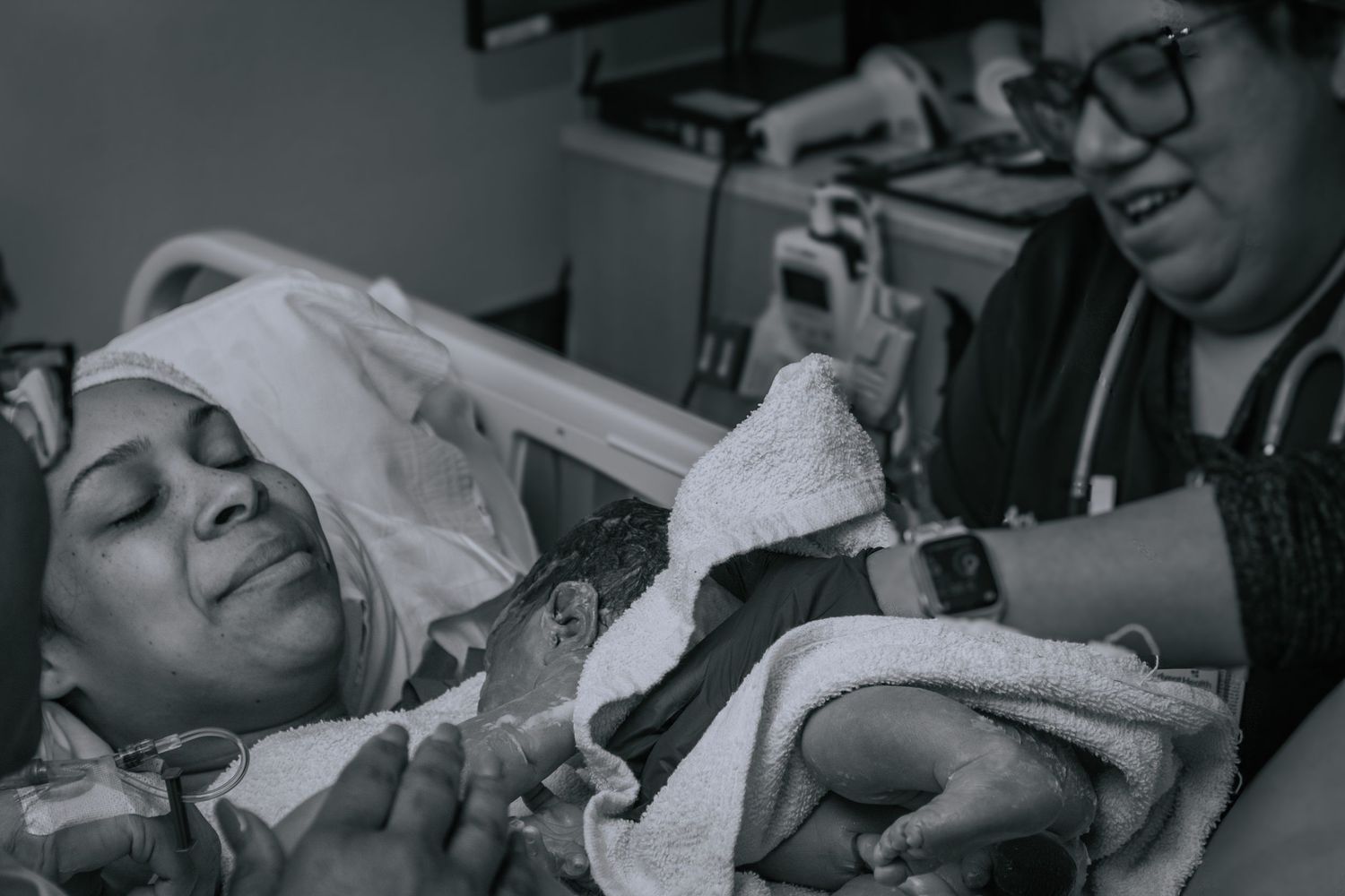 Copperas Cove birth photographer capturing mother holding baby for first time.