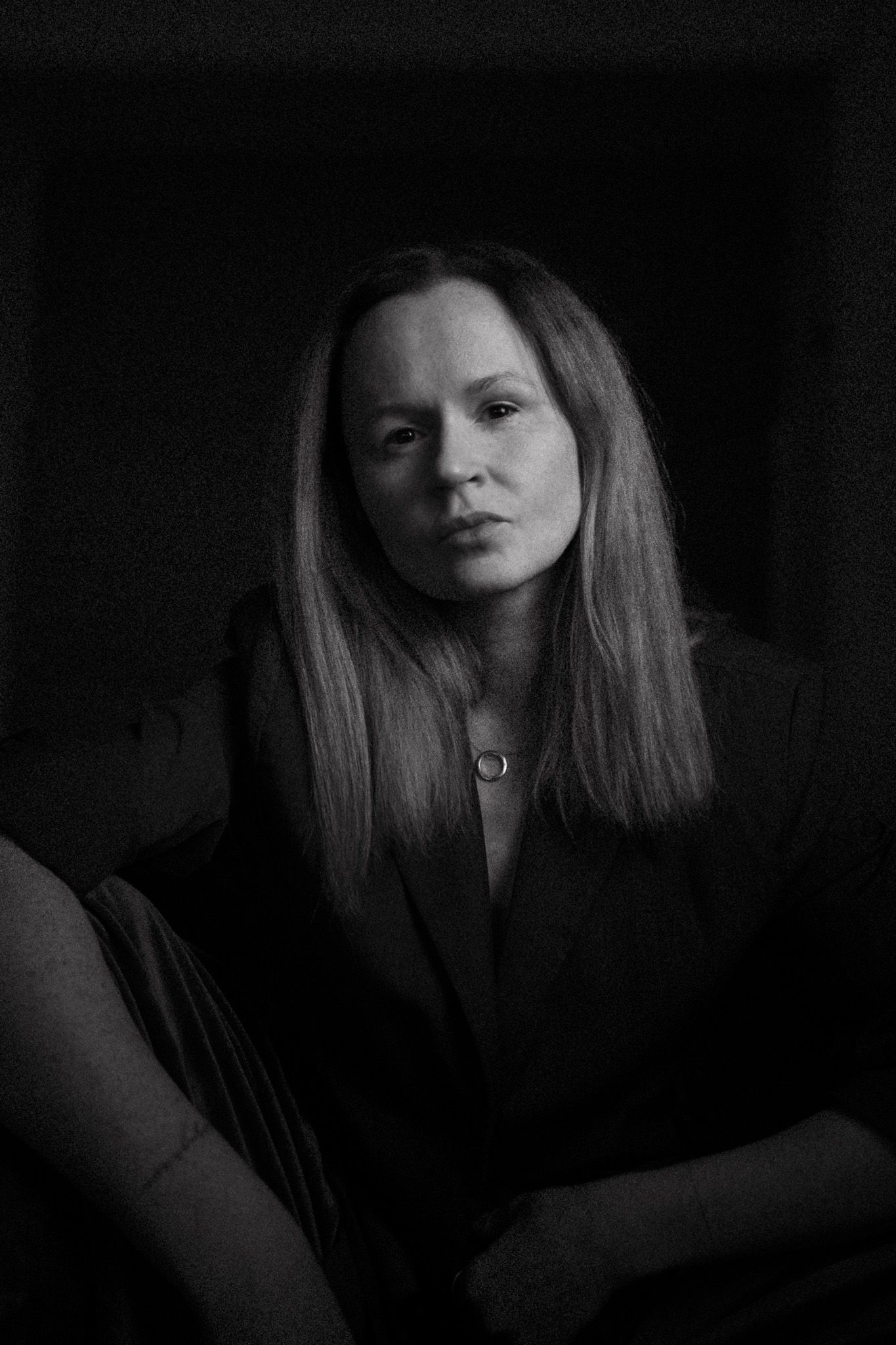 Artistic black and white portraits with dramatic shadows and contrast.