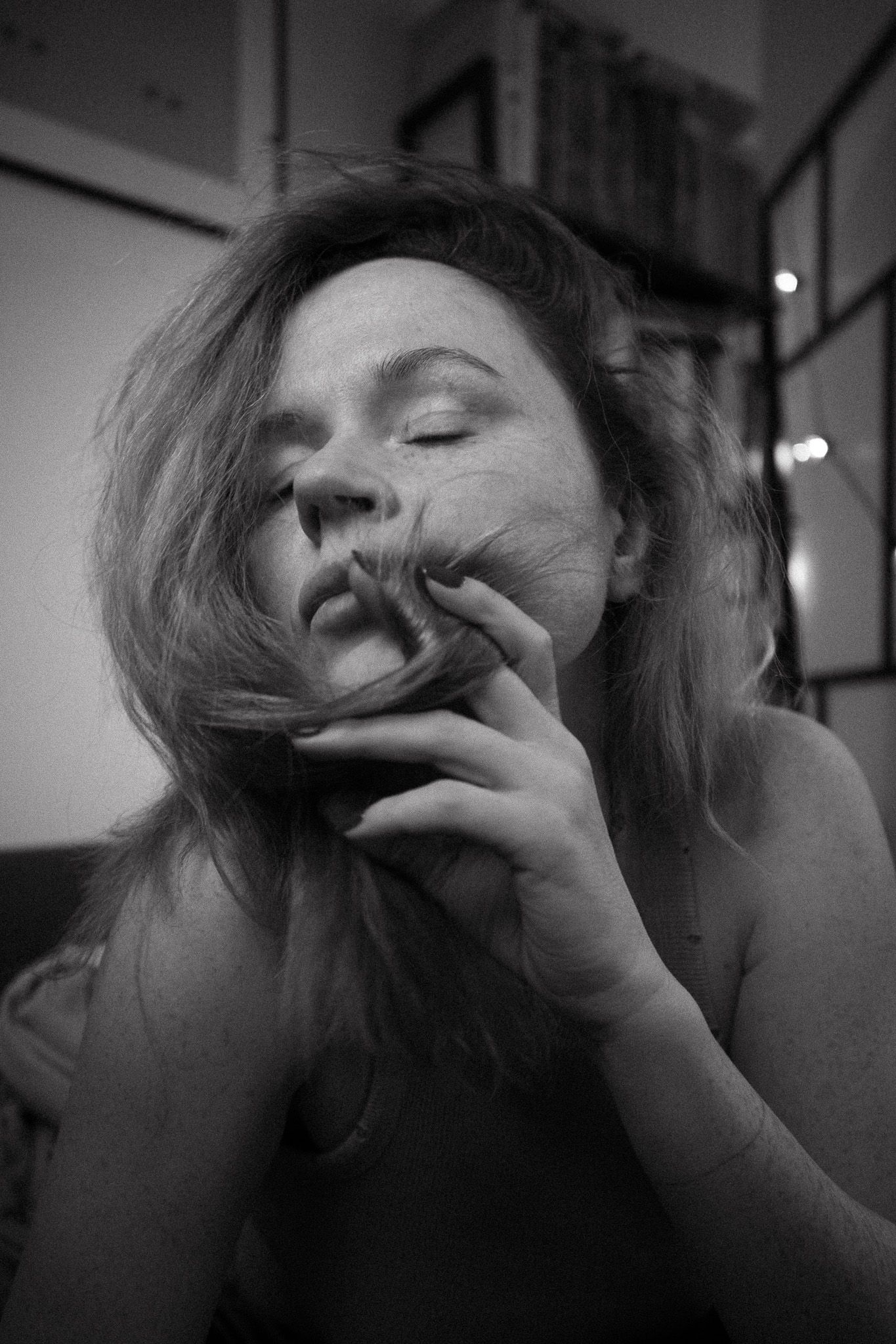 Intimate black and white portrait series with dynamic hand movements and expressions.
