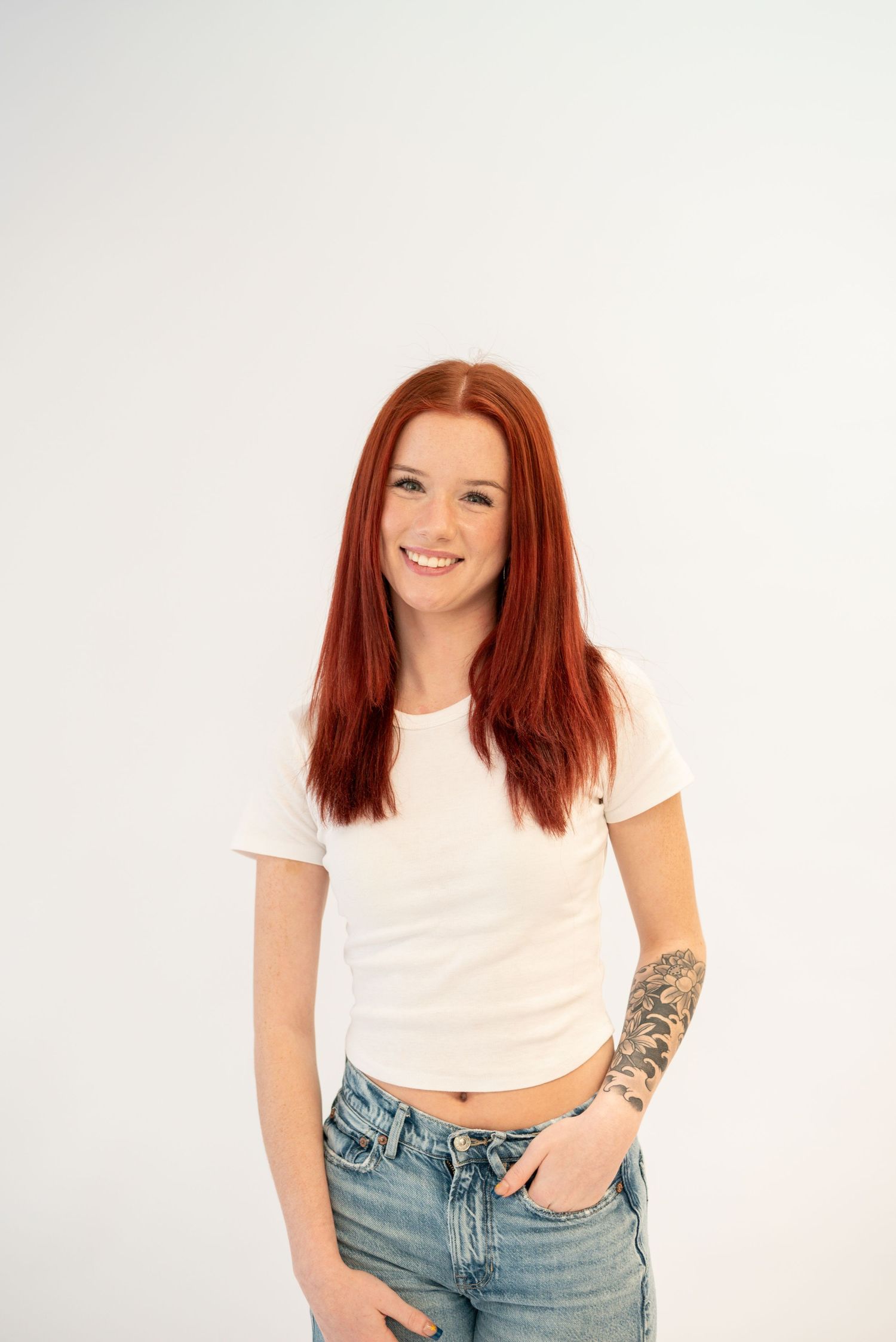 Casual studio portraits showing natural expressions against clean white backdrop.