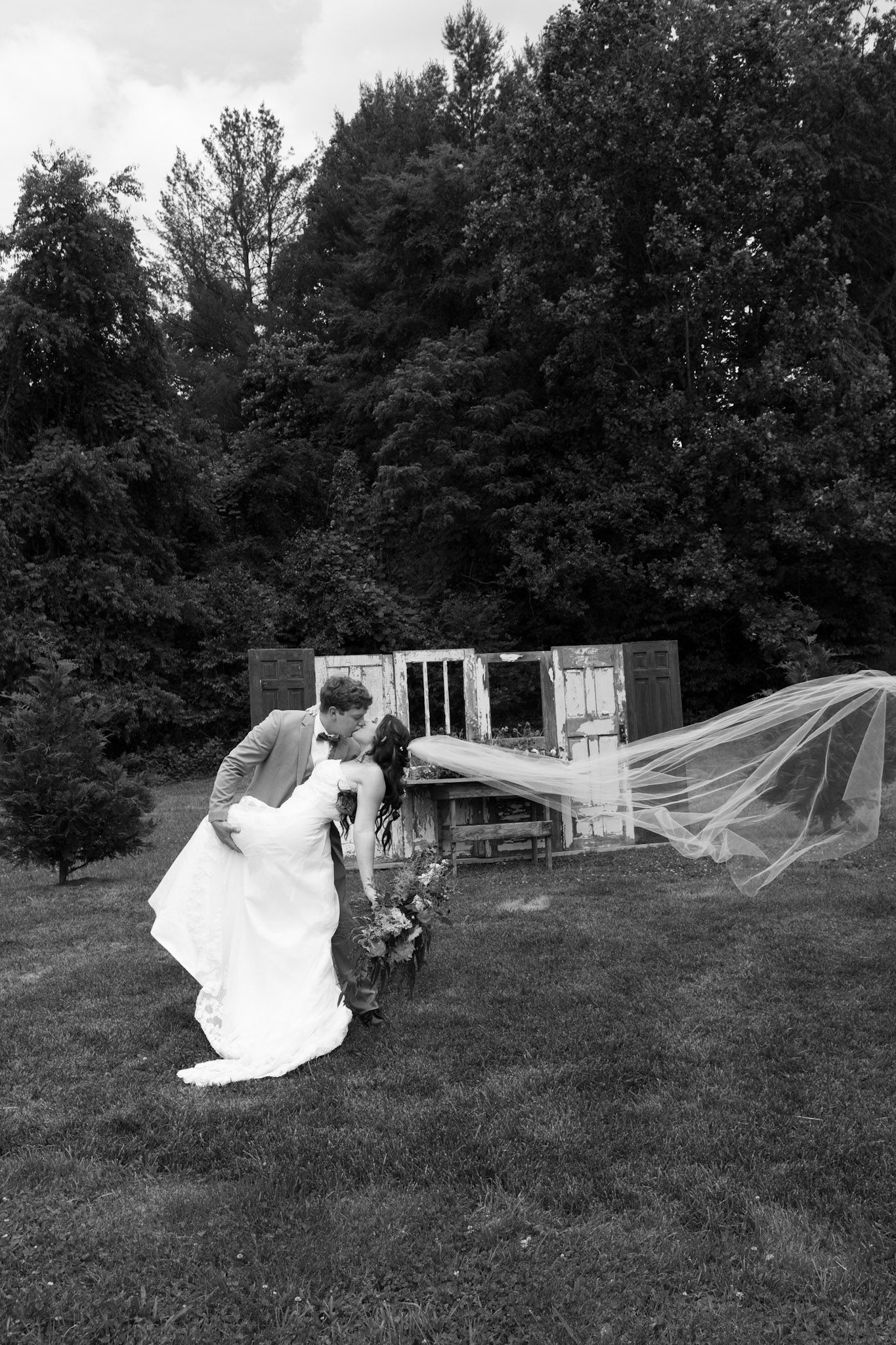 Black and white photos of a flowing wedding veil dancing in the wind.
