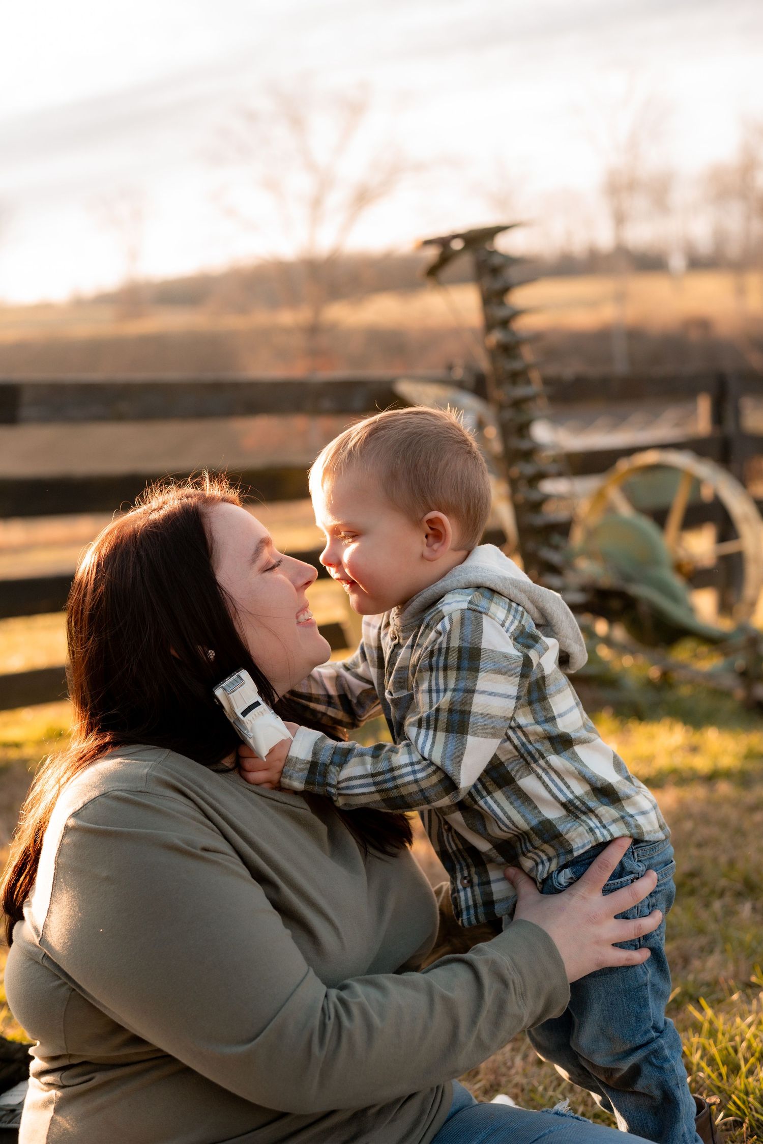Candid outdoor family photos capturing playful interactions in golden evening light.