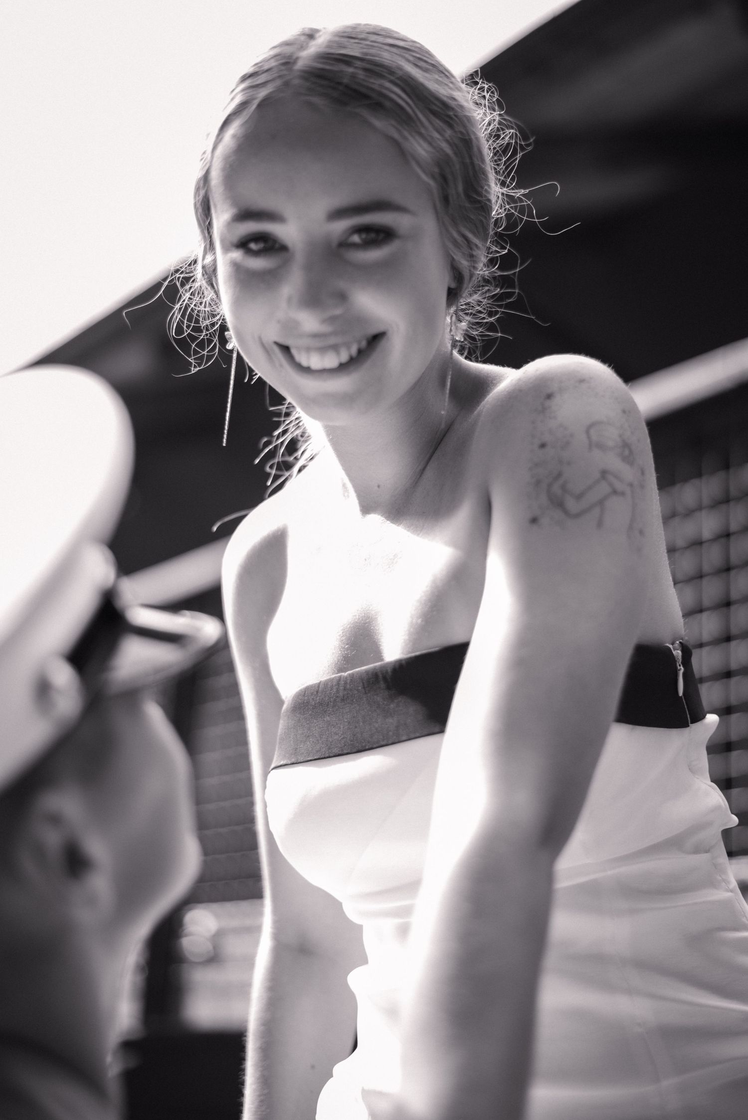 Black and white series showing joyful moments in a wedding dress.