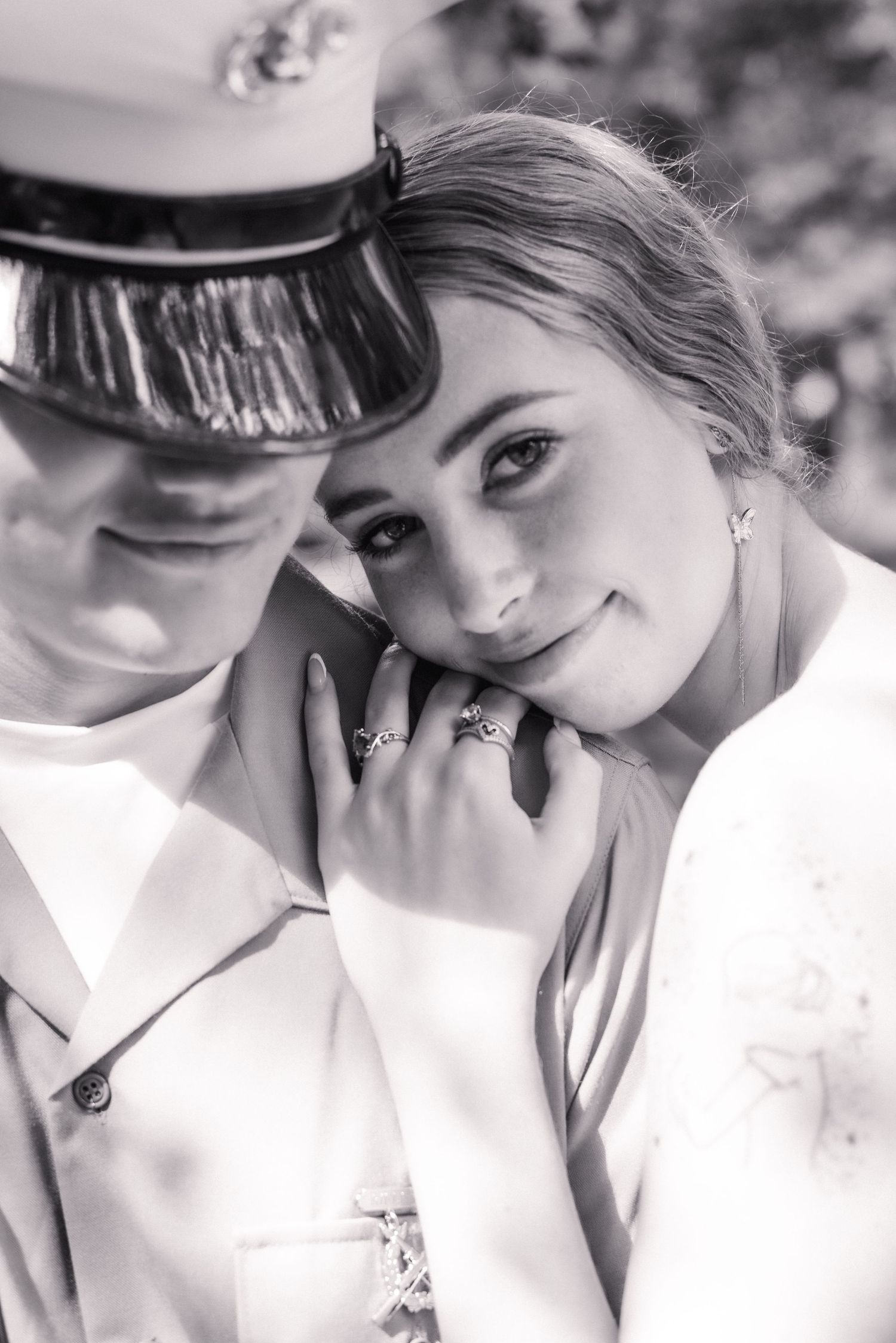 Black and white portrait series showing intimate poses in formal attire.