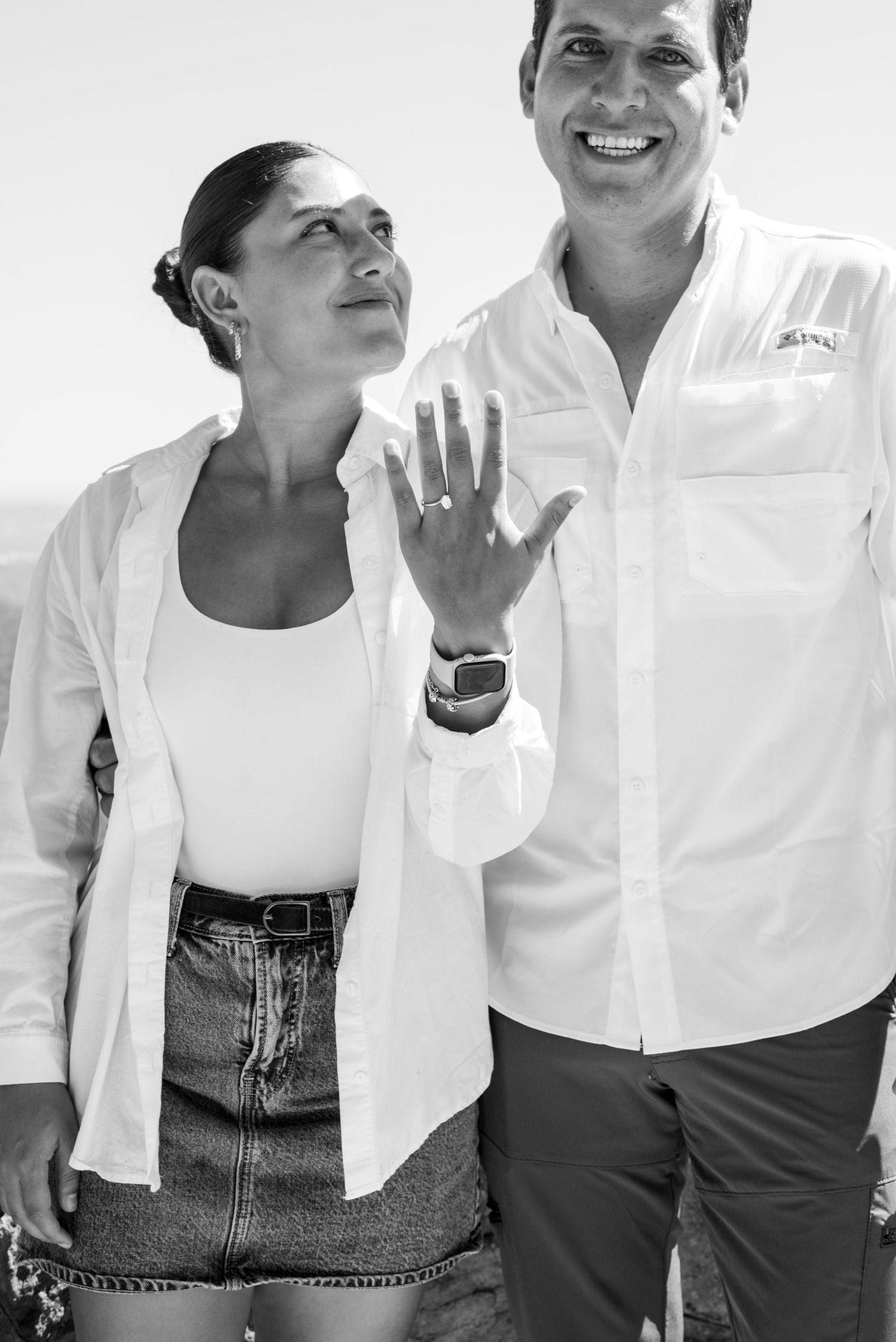 Candid moments captured in black and white showing casual poses in white outfits.