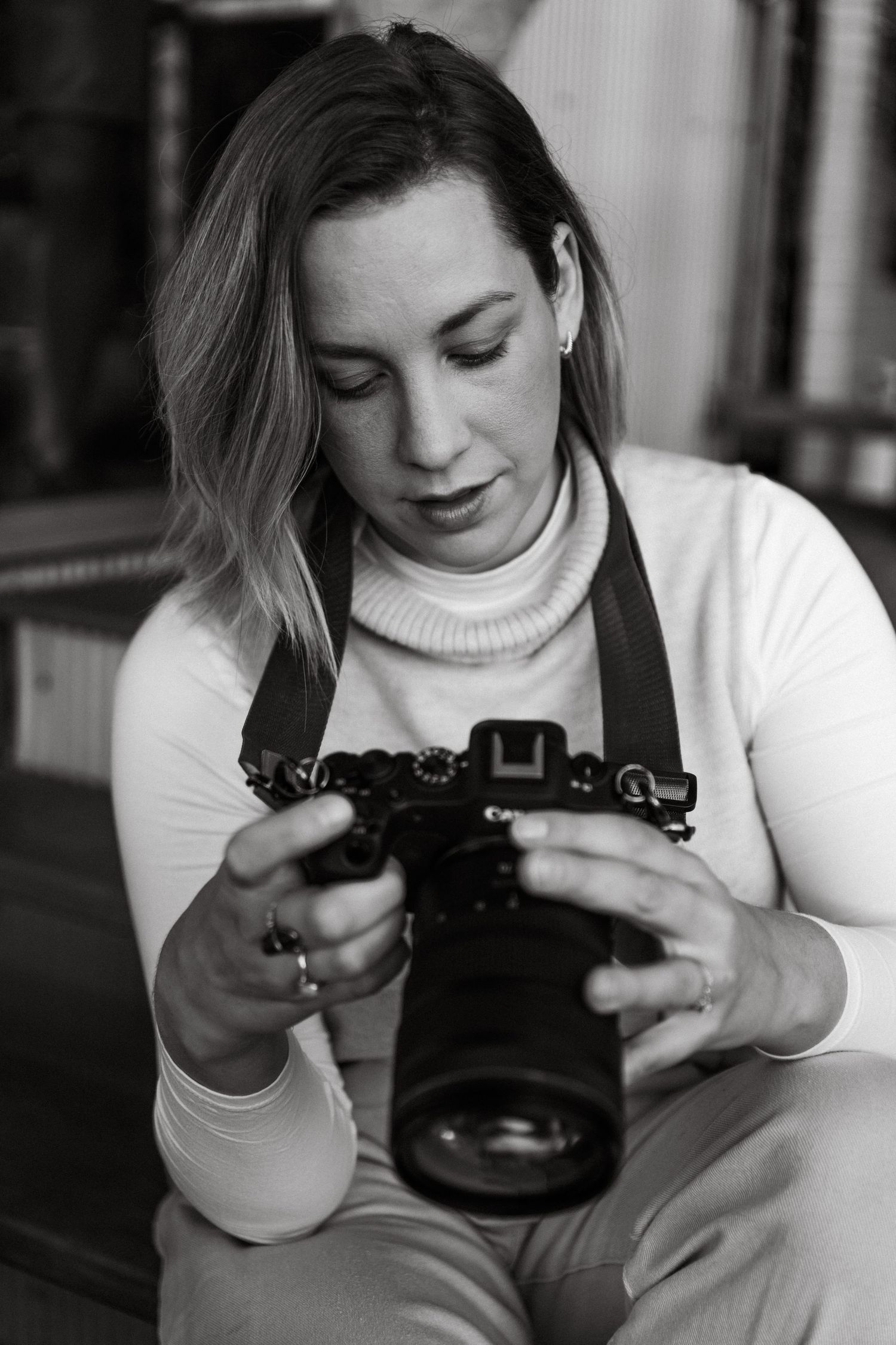 Photographer holding camera
Photographer reviewing camera settings during an in-home branding session for Nurture & Bloom.