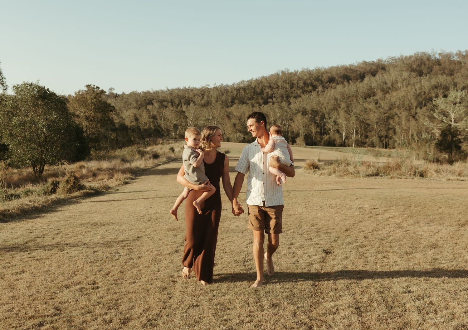 Family walking together outdoors
Family walking hand-in-hand during a golden-hour outdoor photography session in South East Queensland.