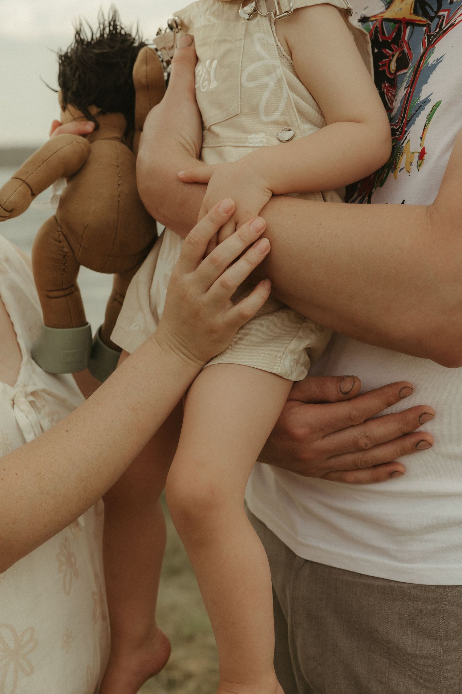 Parents holding toddler close-up
Close-up of parents holding toddler during natural lifestyle family photography session in Brisbane.