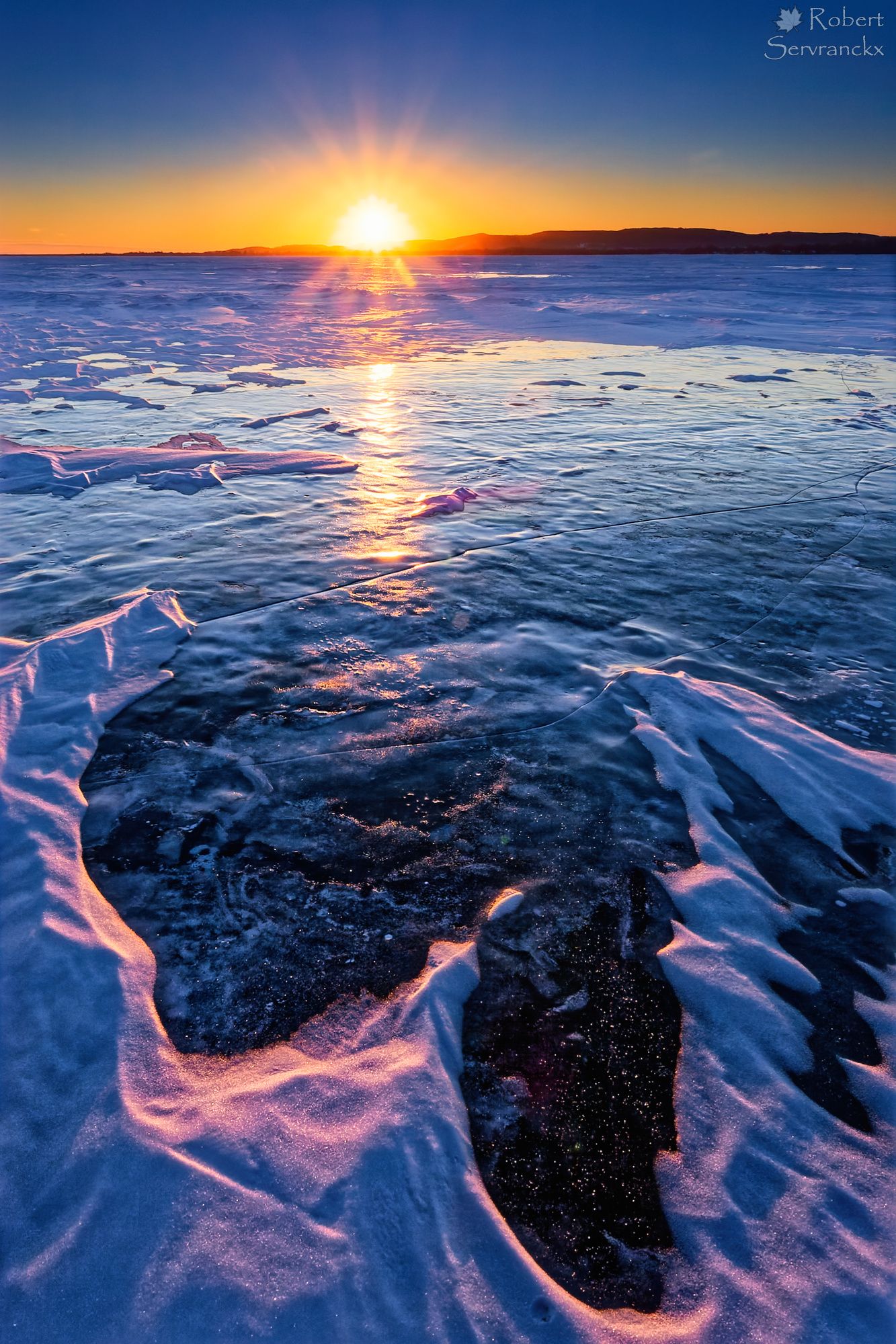 Winter Sunset over Lake of Two Mountains. Quebec - Coucher de soleil hivernal sur le Lac des Deux-Montagnes, Québec