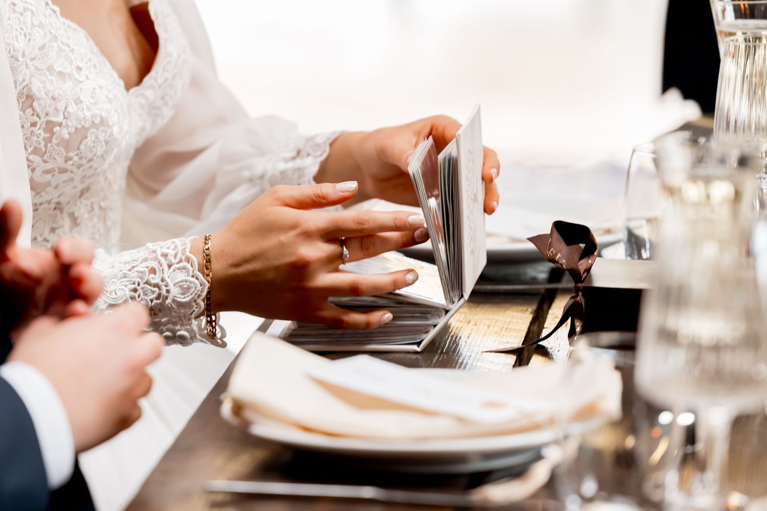 Close-up of table settings and dining details at an elegant wedding reception.