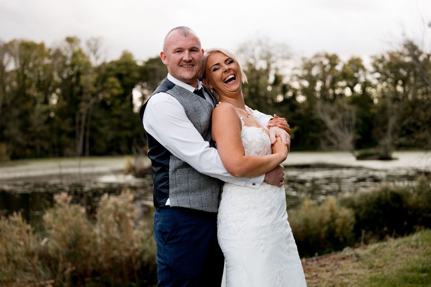Romantic outdoor couple portraits against autumn landscape.