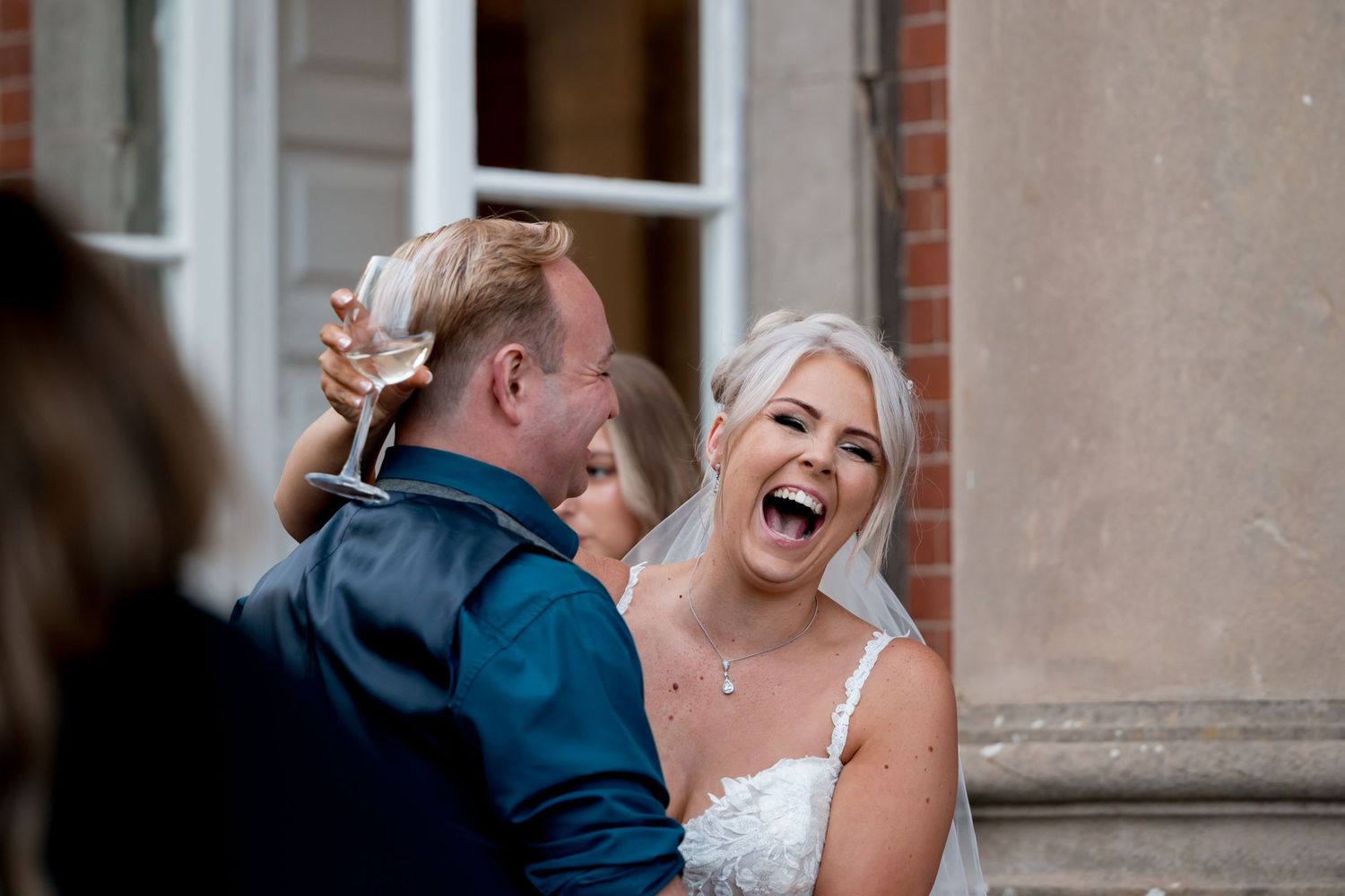 Candid outdoor portrait session with laughter and natural expressions.