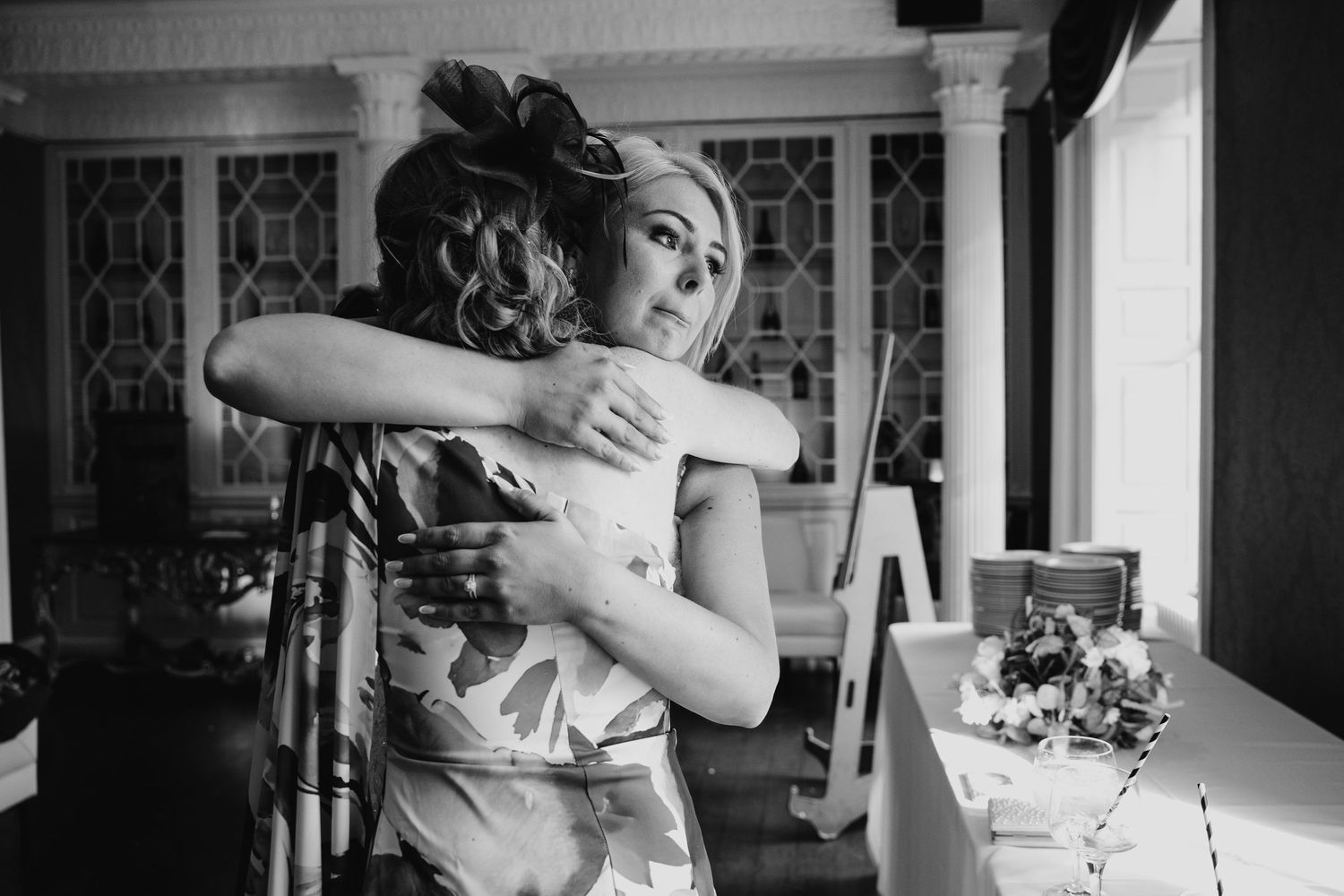 Series of candid moments showing joyful embraces during wedding celebration.