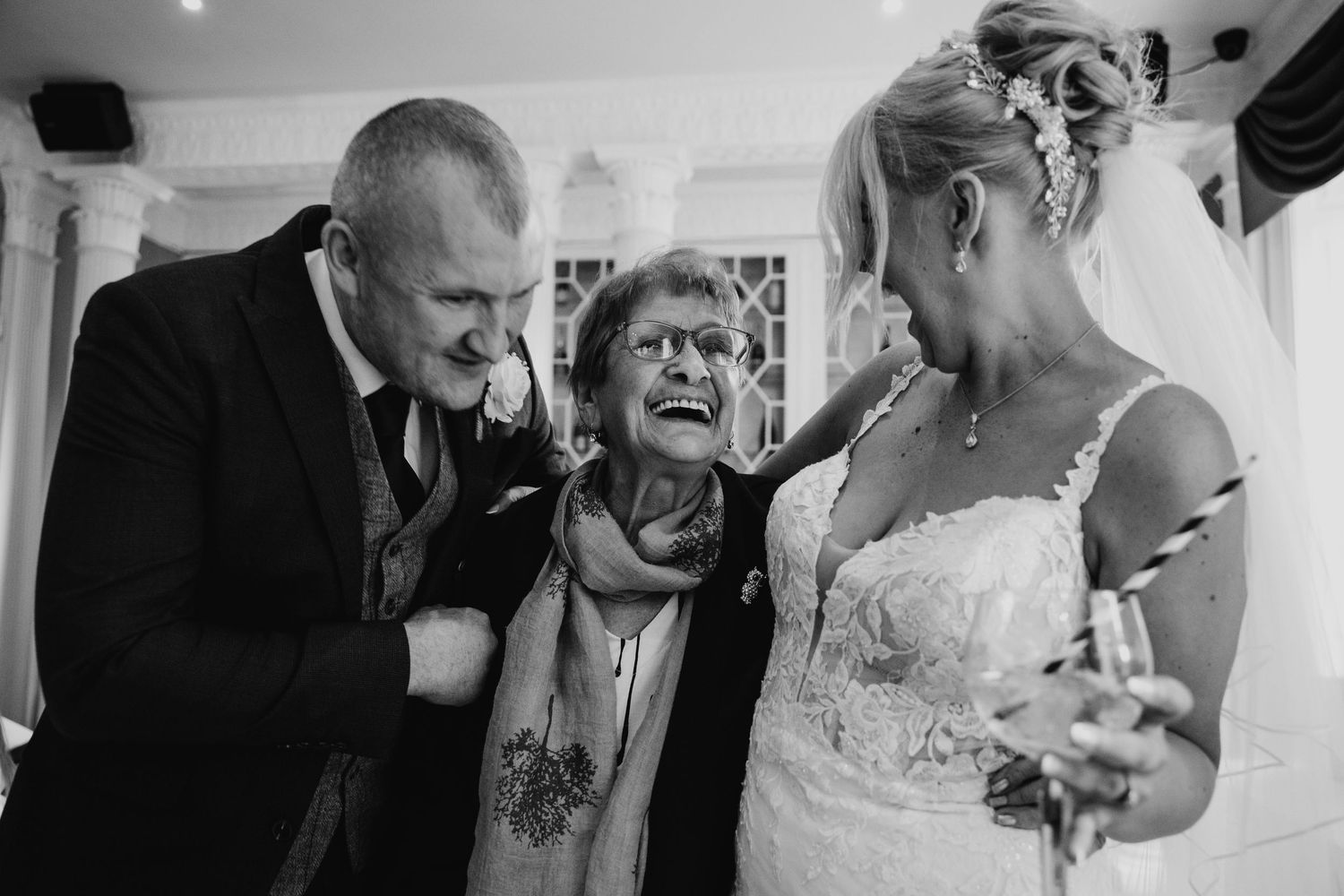 Candid black and white photographs capturing emotional moments during wedding celebration.