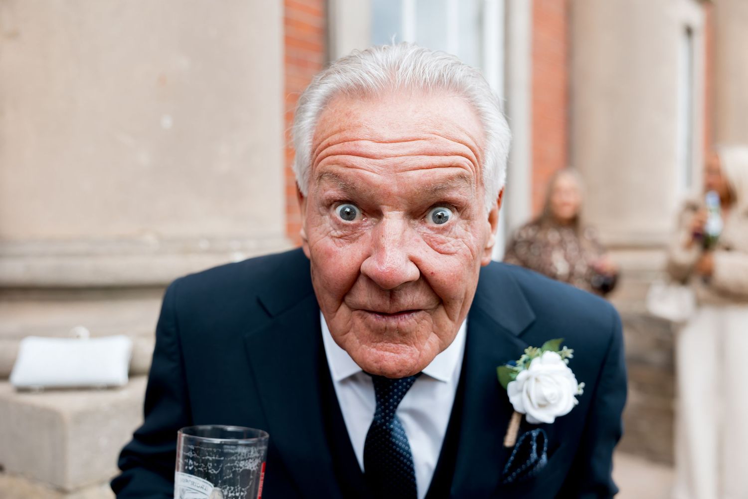 Close-up portrait showing joyful expressions and formal attire.