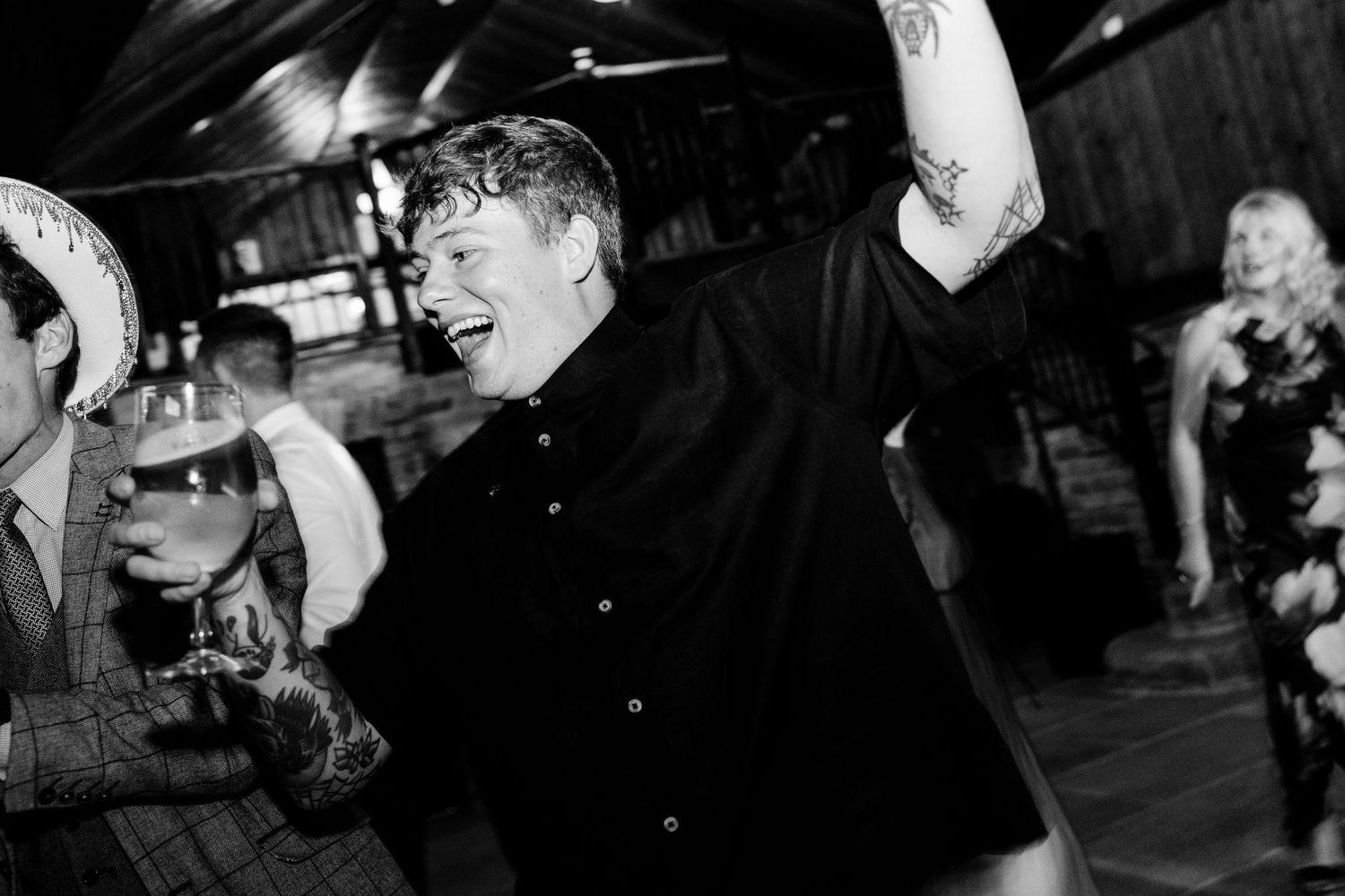 Black and white candid shots of wedding reception celebration.