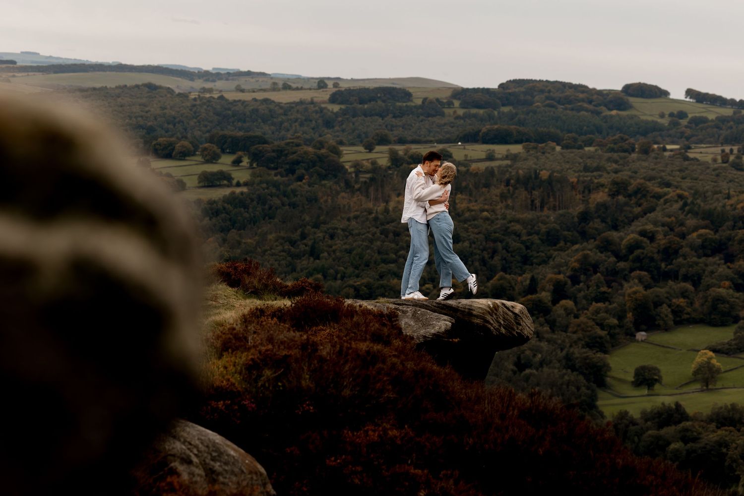 A romantic sunset engagement photo session in a scenic mountain landscape.