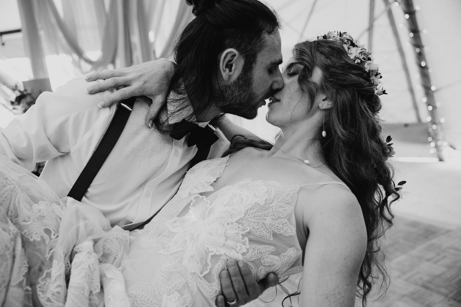 Black and white photograph of a romantic dance moment at a wedding celebration.
