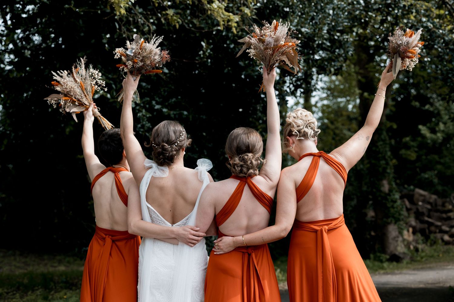 Donington Park Farmhouse wedding venue featuring rustic brick buildings, timber barn structures, and open countryside views