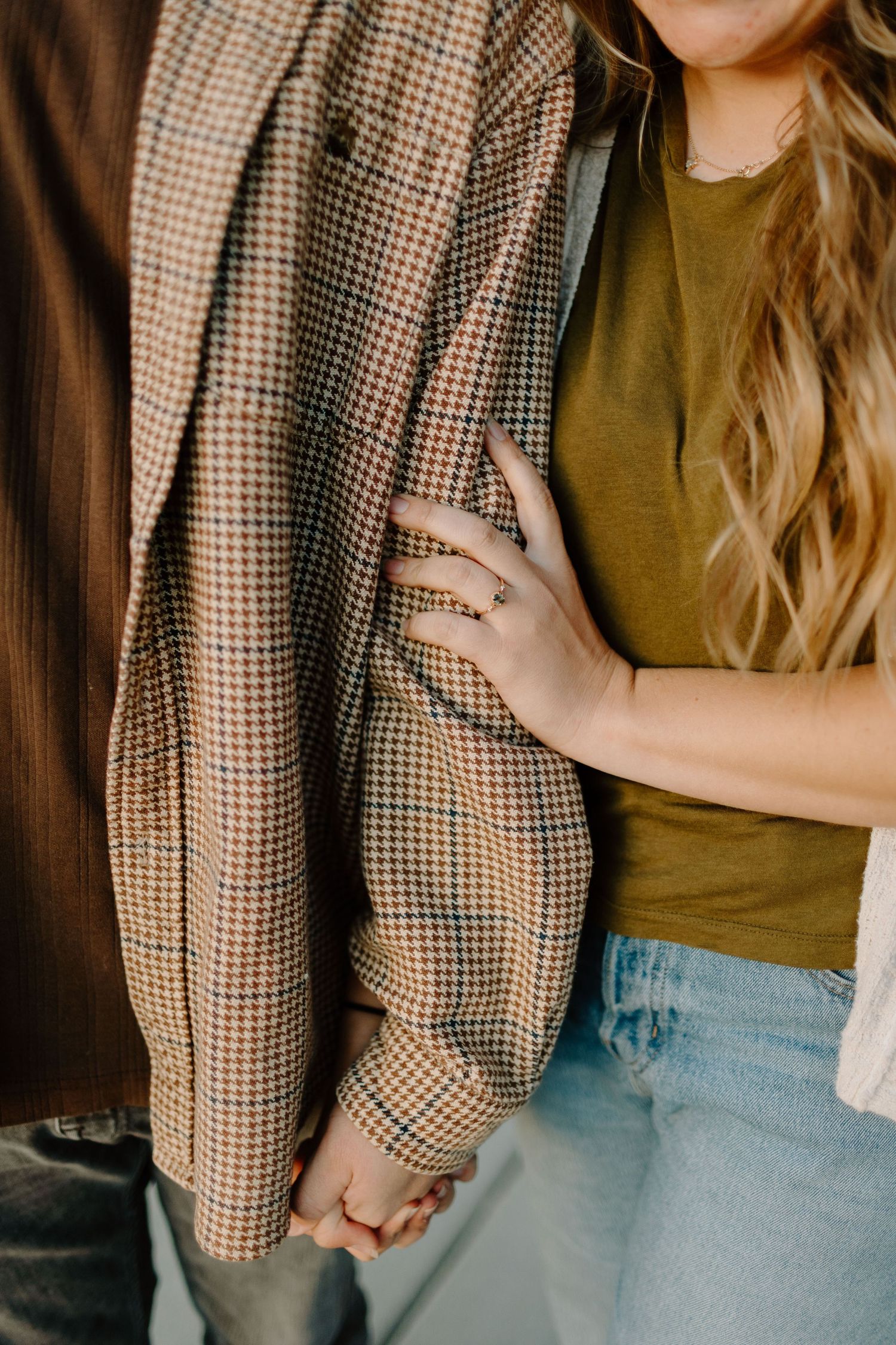 Detail shots of a couple wearing casual clothes with plaid jacket and denim.