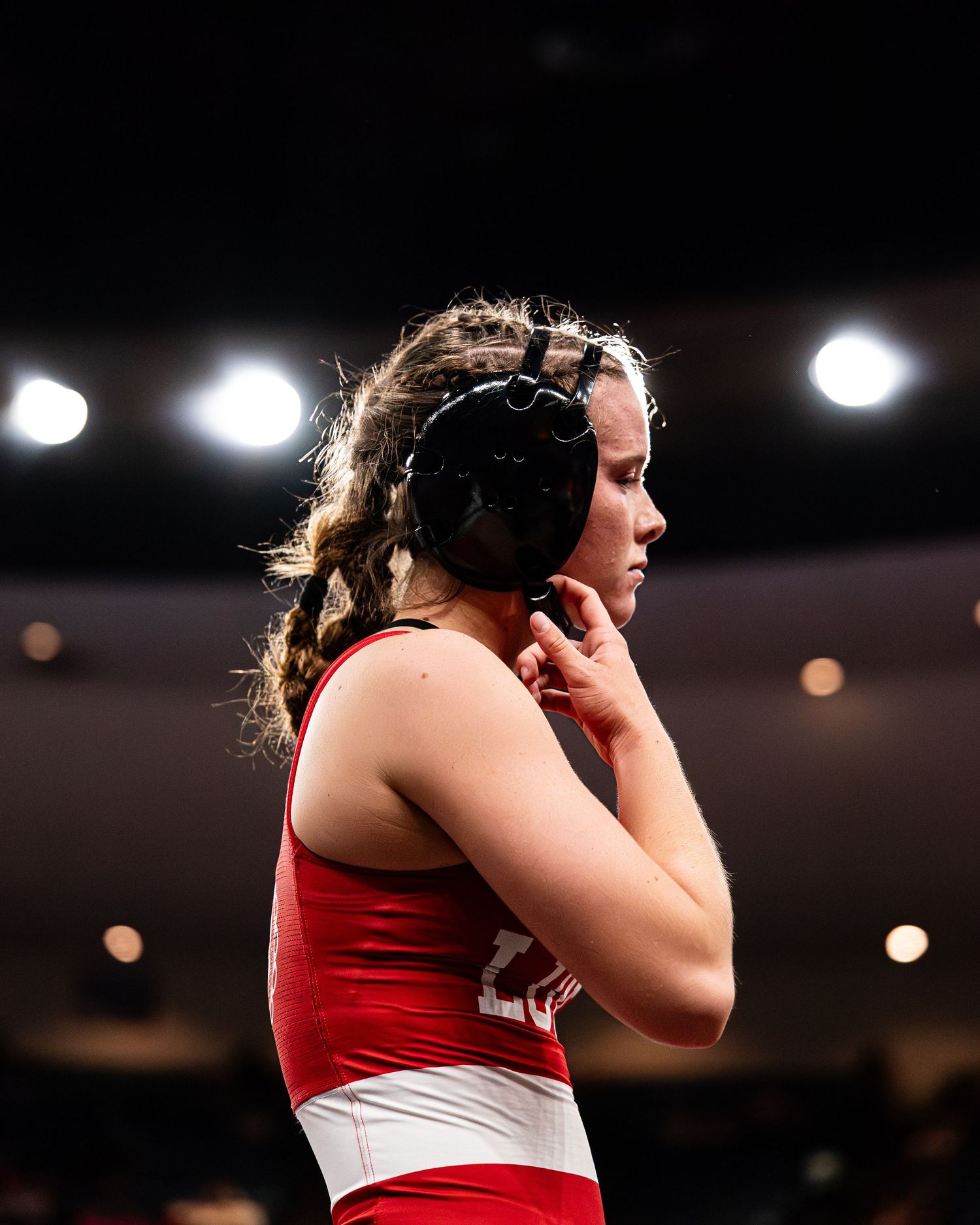Wrestlers grappling on the mat during a Hawaii state championship