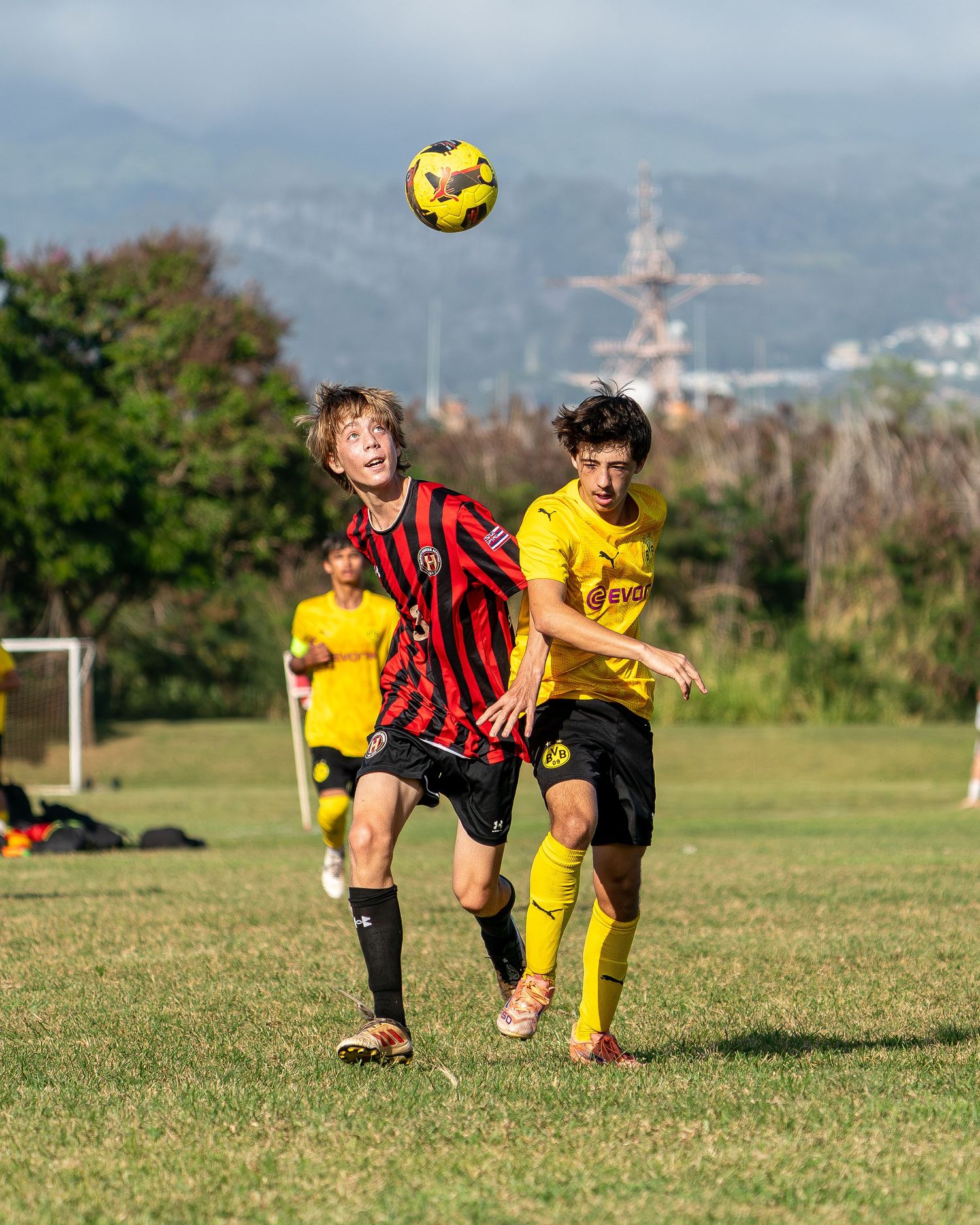 Soccer goalkeeper making a save during a Hawaii high school game