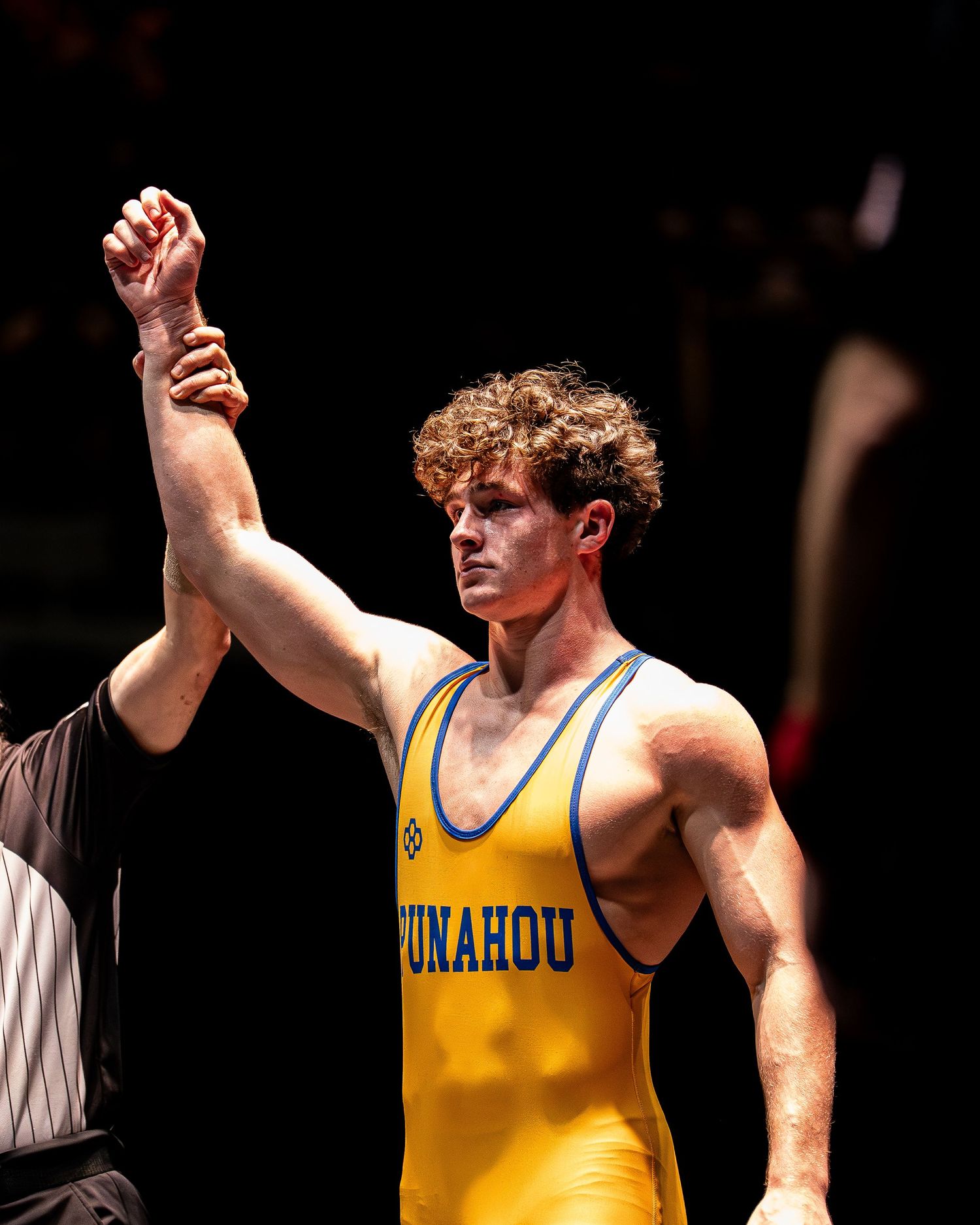 High school basketball player shooting over a defender in Hawaii