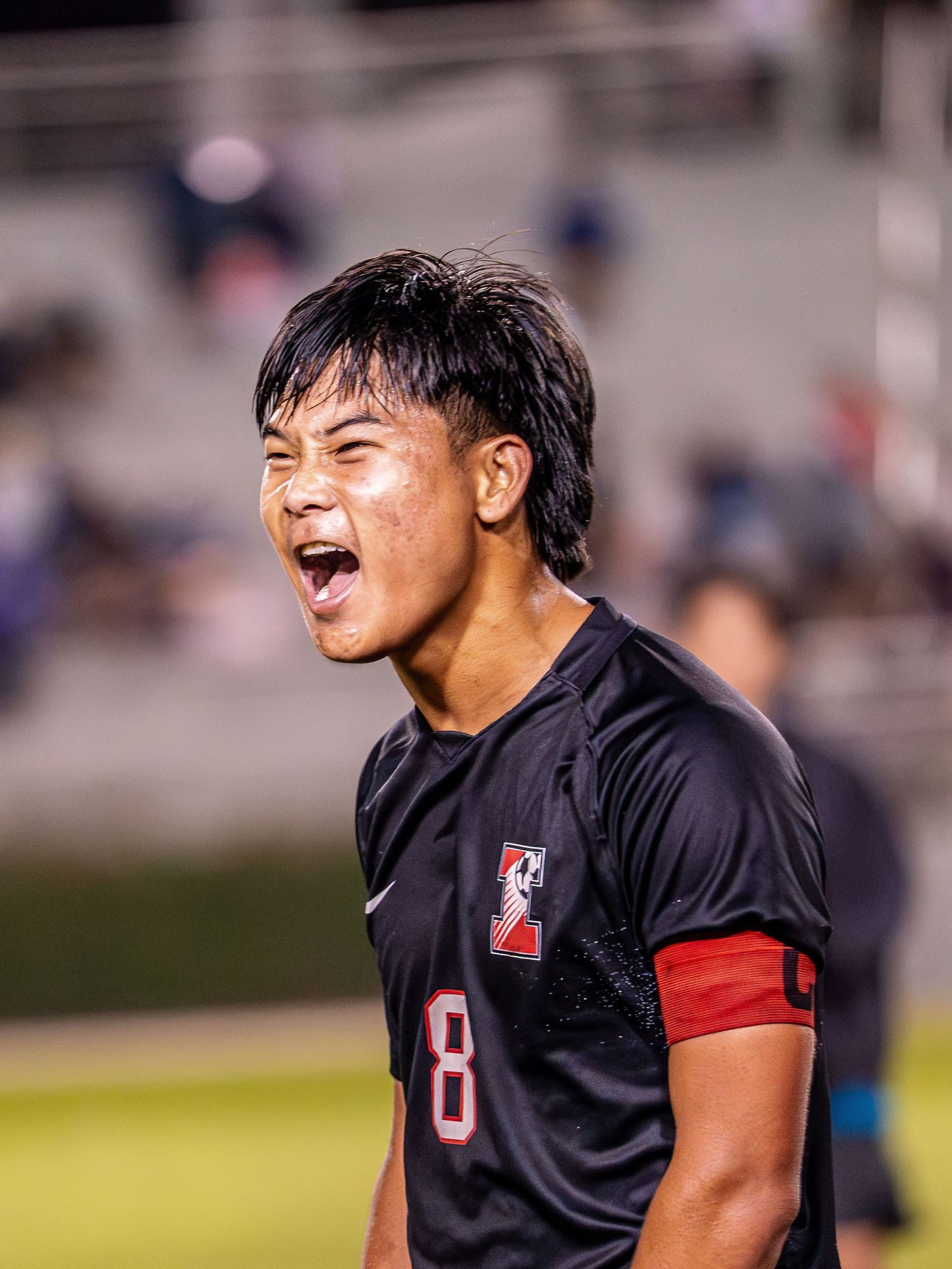 Soccer team huddle during a fall season game in Hawaii