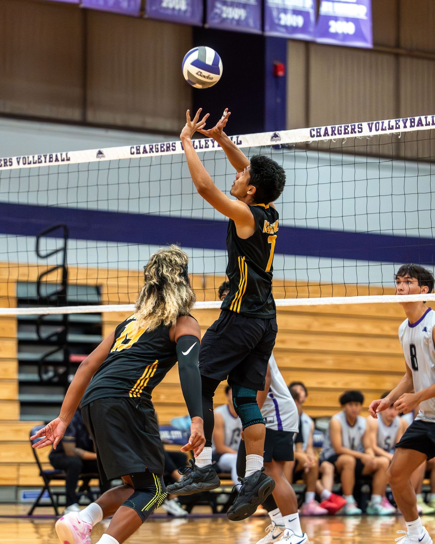 Baseball runner sliding into base during a spring season game in Hawaii