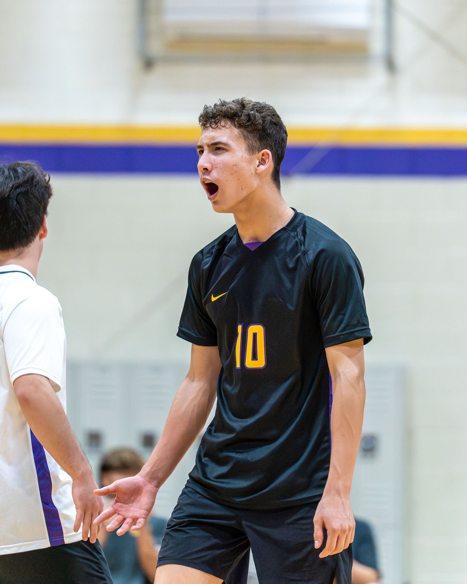 Baseball infielder fielding a ground ball during a spring game