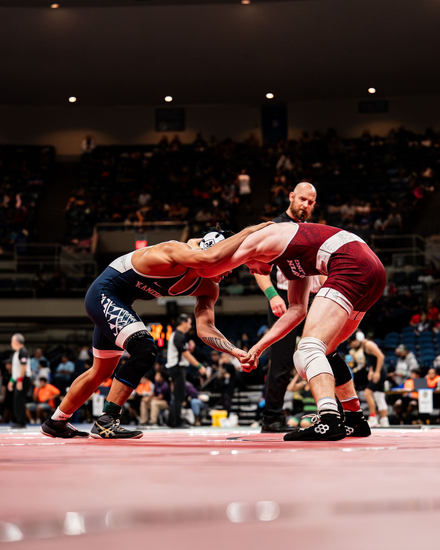 Basketball player soaring for a dunk during a Division I game in Hawaii