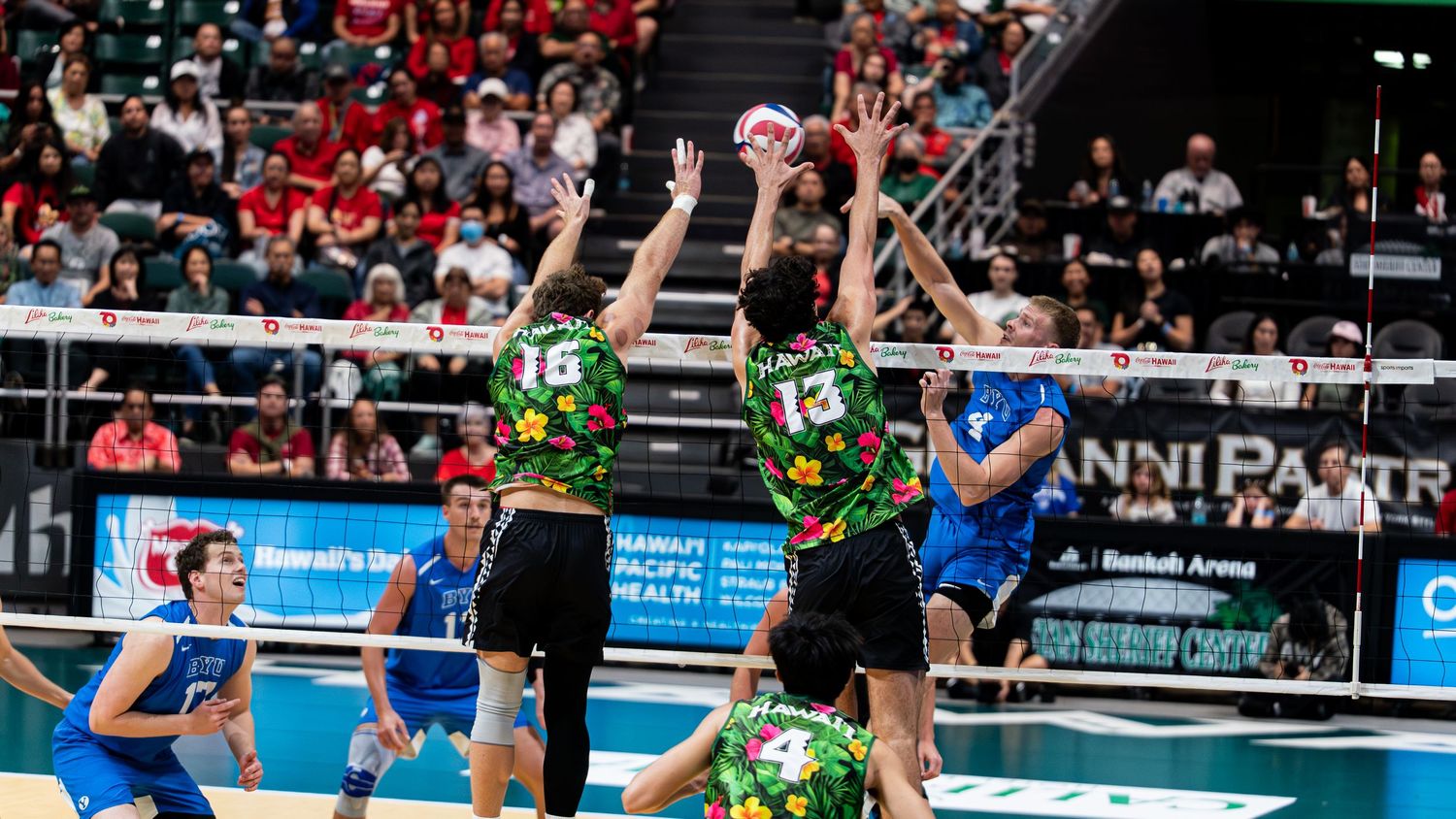 Volleyball player jumping to spike during a spring match