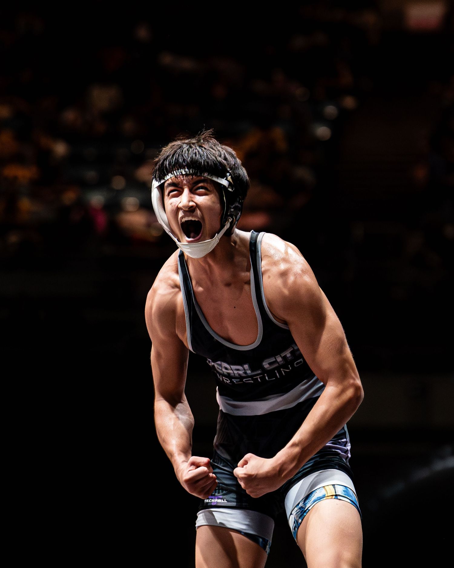 Basketball player driving through defenders in a winter league game