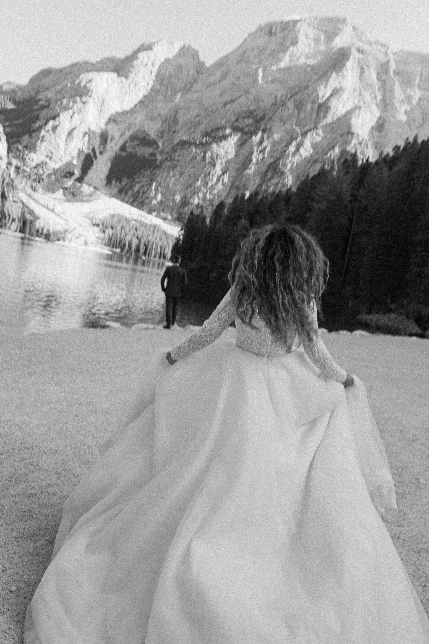 A sequence of black and white landscape photos showing mountains and trees in the background with a figure in the foreground.
