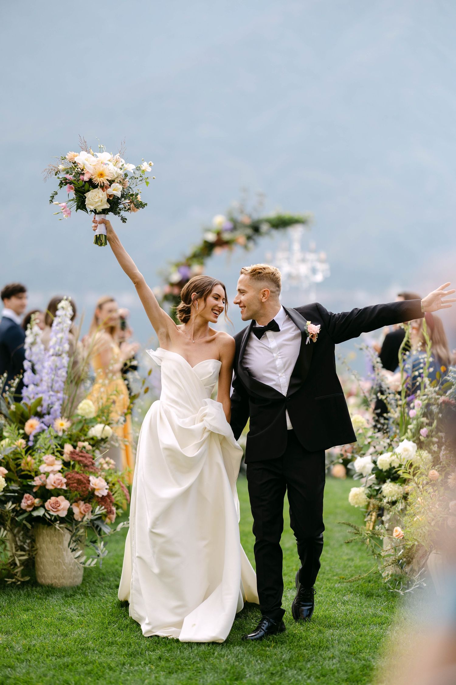 Wedding couple celebrates walking down the aisle on theri wedding in italy