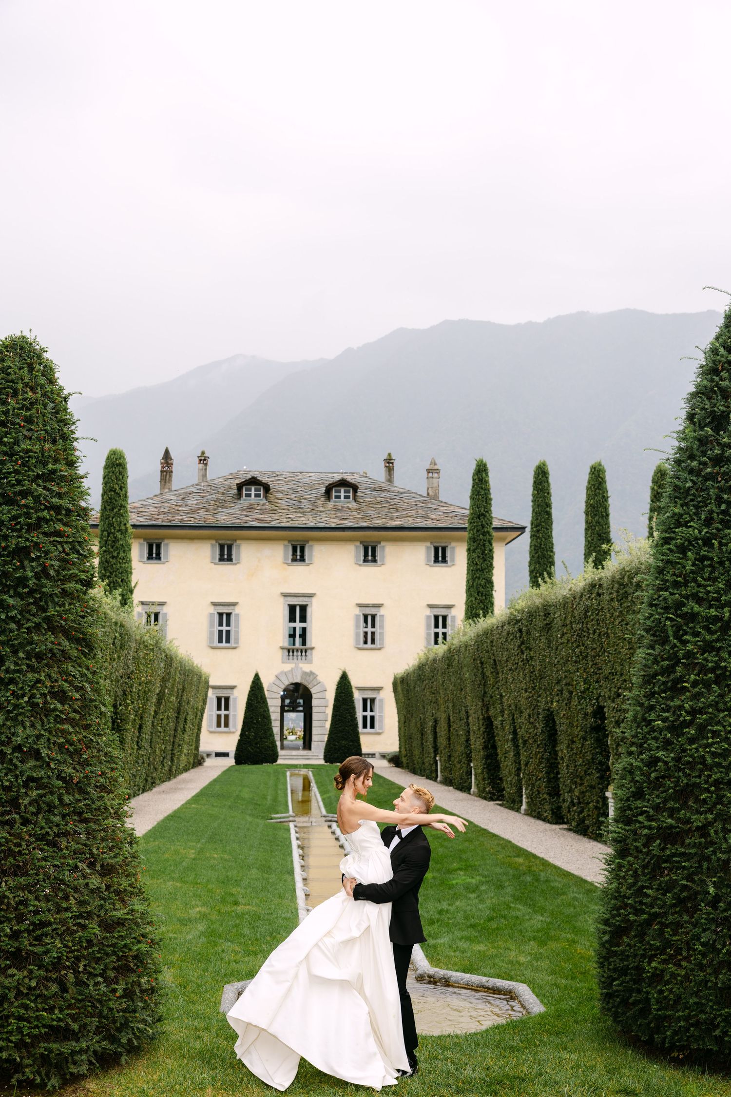 editorial wedding photographt of a couple dances in italy at villa balbiano