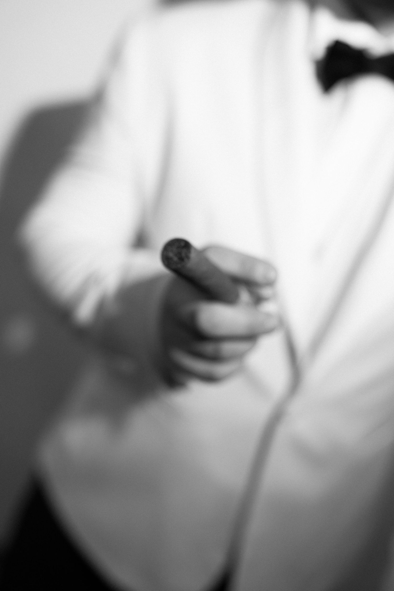 Portrait of a groom at his wedding day in black and white editorial vibes