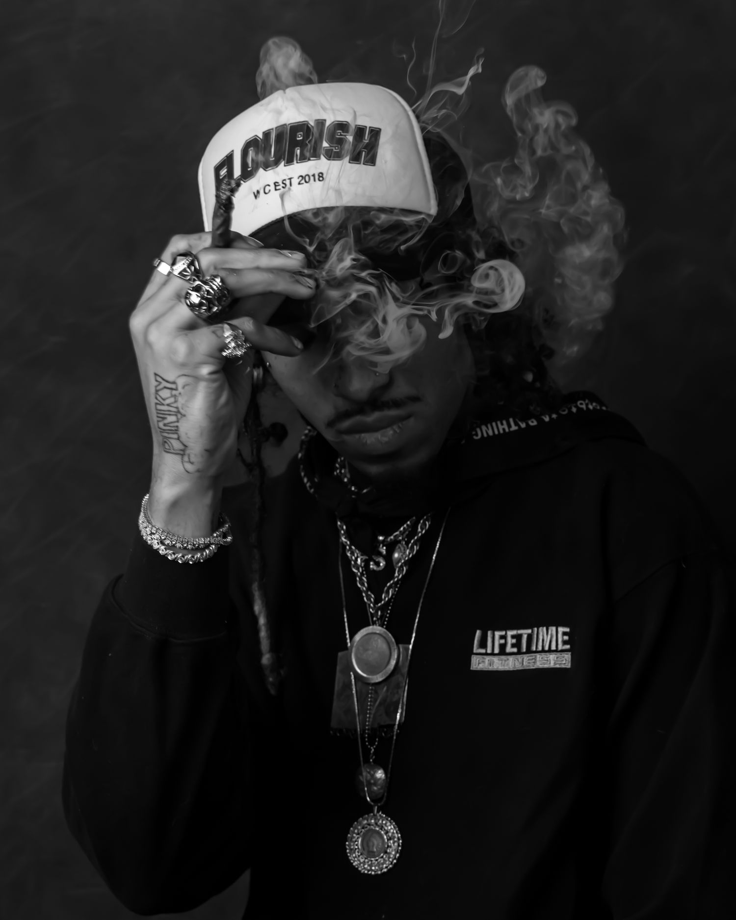 Black and white portraits showing smoke and streetwear style.