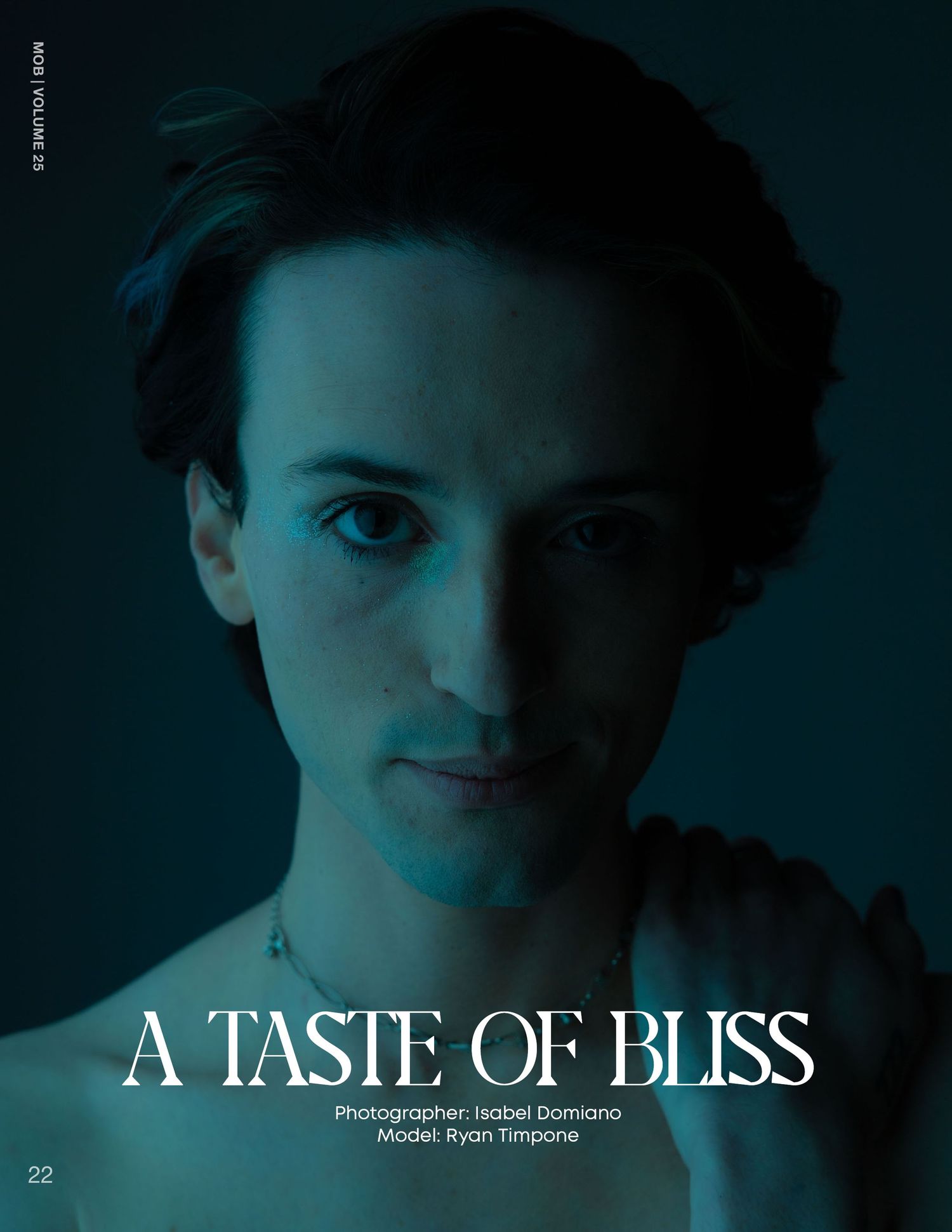 Shirtless male model Ryan Timpone in moody teal lighting for editorial shoot A Taste of Bliss.