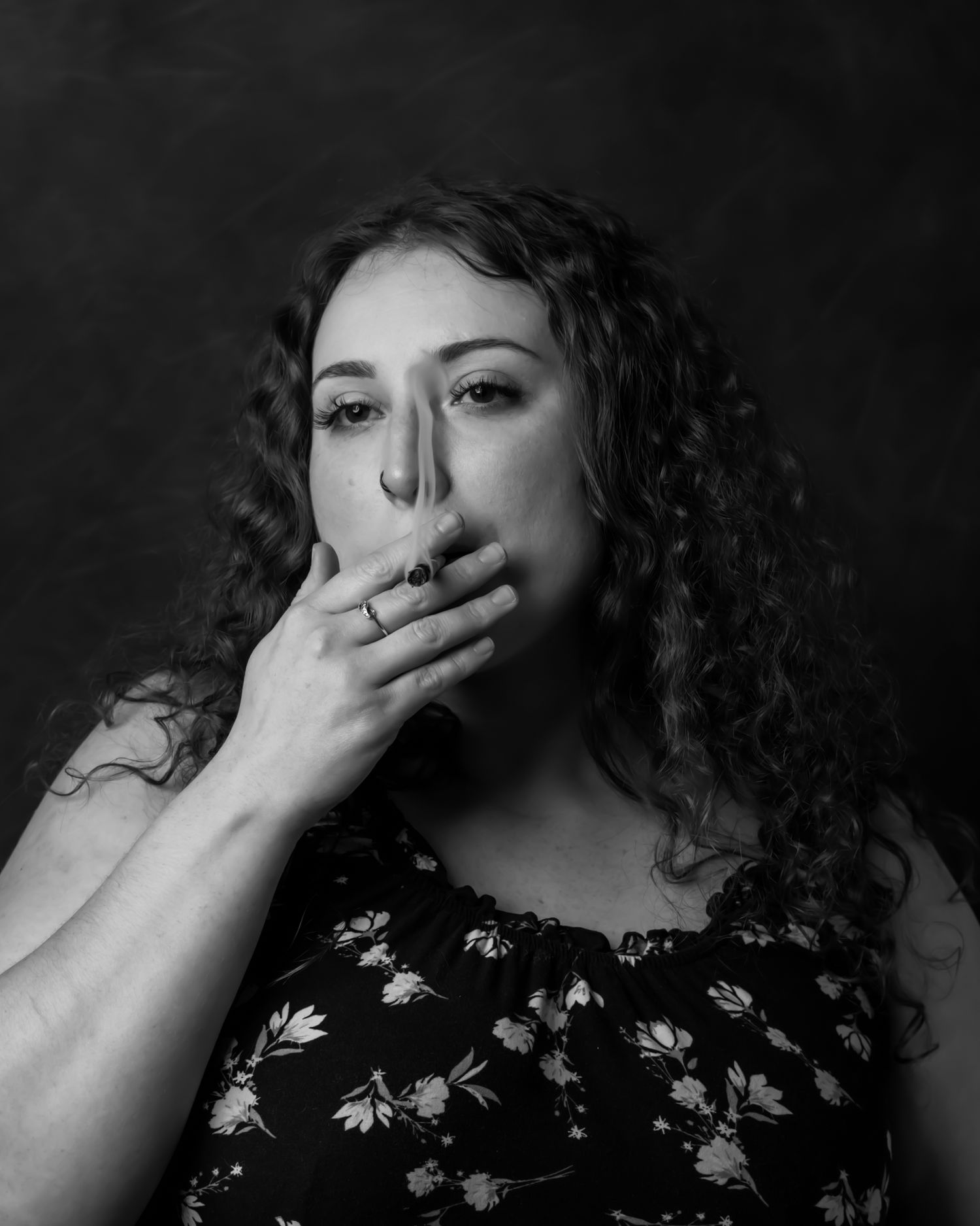 Dramatic black and white portrait series with expressive hand gestures.